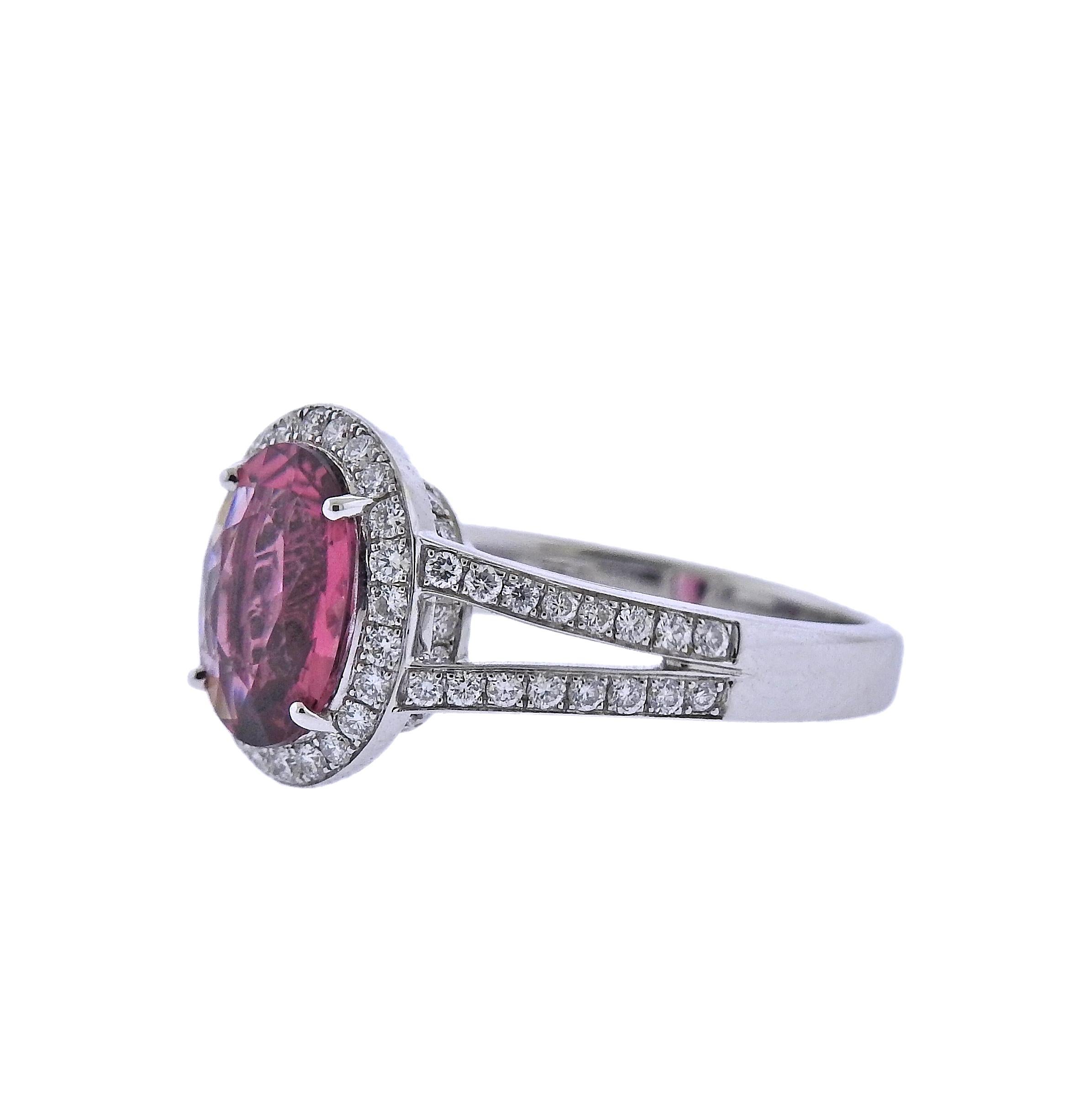 Brand new with tag Bucherer ring, with center 2.46ct pink tourmaline and 0.56ctw VS/G diamonds. Ring size - 6; top measures 13mm x 12mm. Weight: 6.3 grams. Marked: CB,750. .  With original  box.