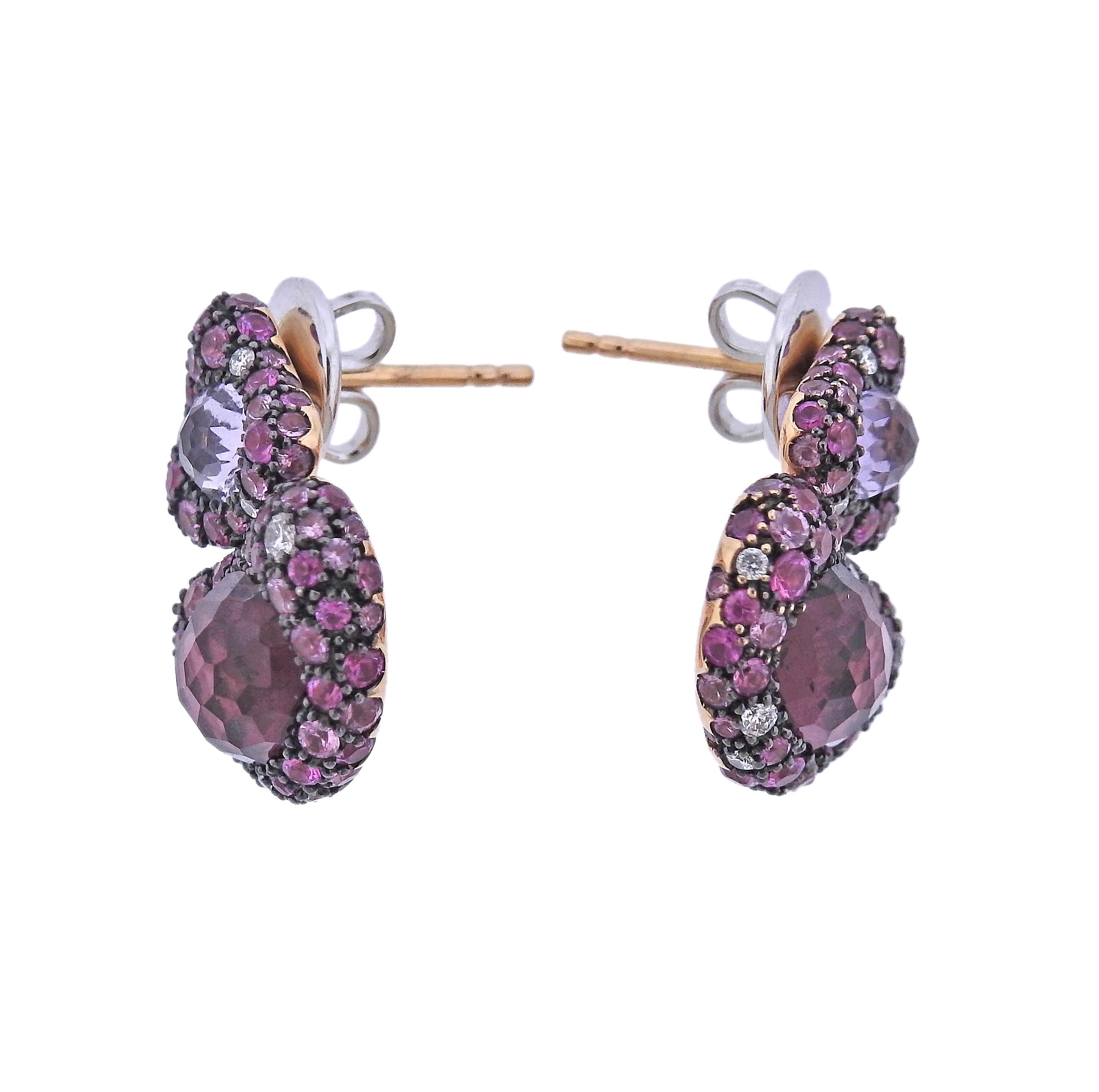 Brand new with tag Bucherer earrings, 18k gold, with 0.21ctw Si/H diamonds, 4.65ctw rhodolite, 1.00ctw amethyst and 3.19ctw sapphires.  Retail $5380. Comes with box. Earrings are 21mm x 17mm. Weight - 13.6 grams. Marked: CB 750.
