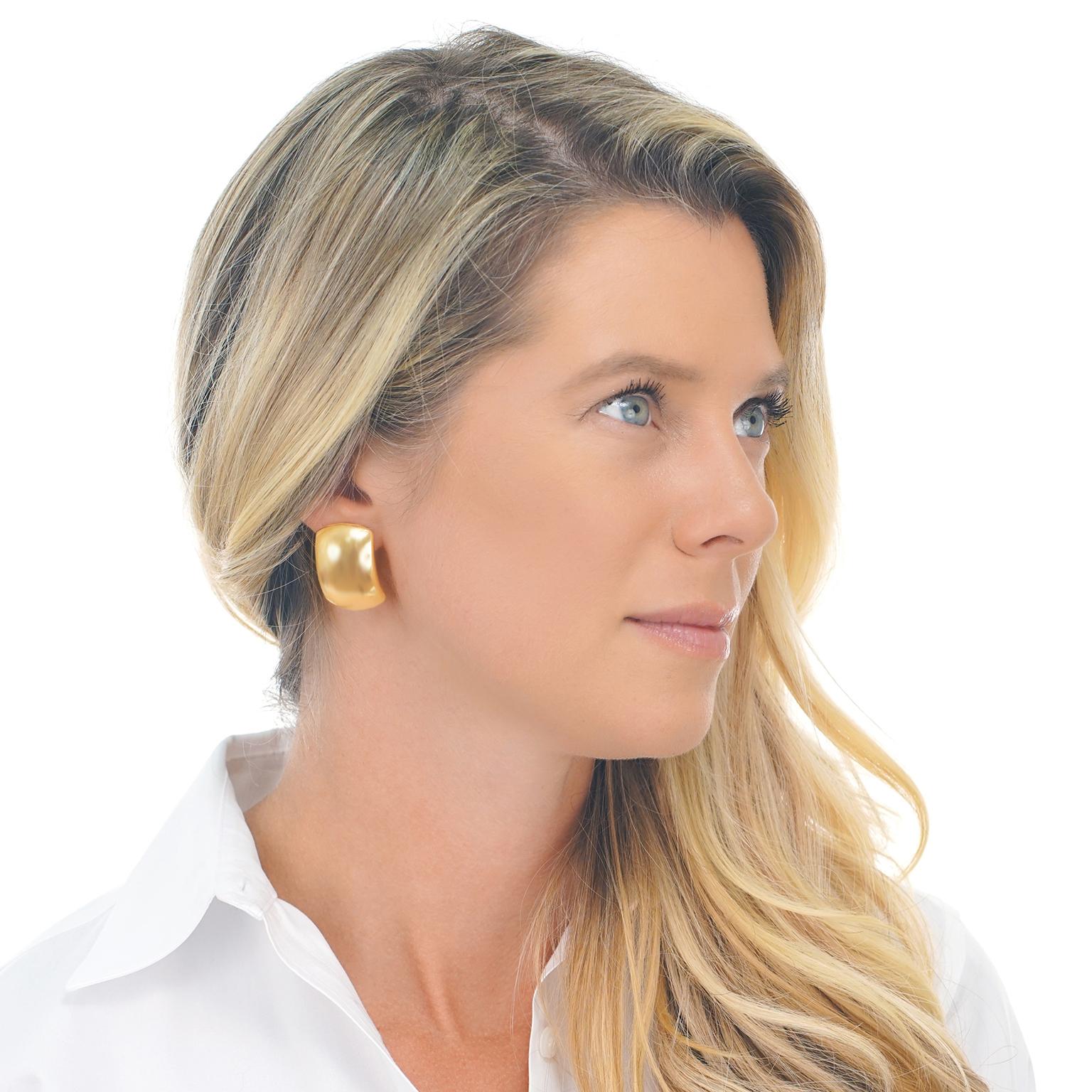Circa 2000s, 18k, by Bucherer, Switzerland.   These yellow gold earrings effortlessly go with everything. Especially glamorous with casual fashion, they are beautifully designed and finely fashioned. Pieces from Bucherer are passionately Swiss