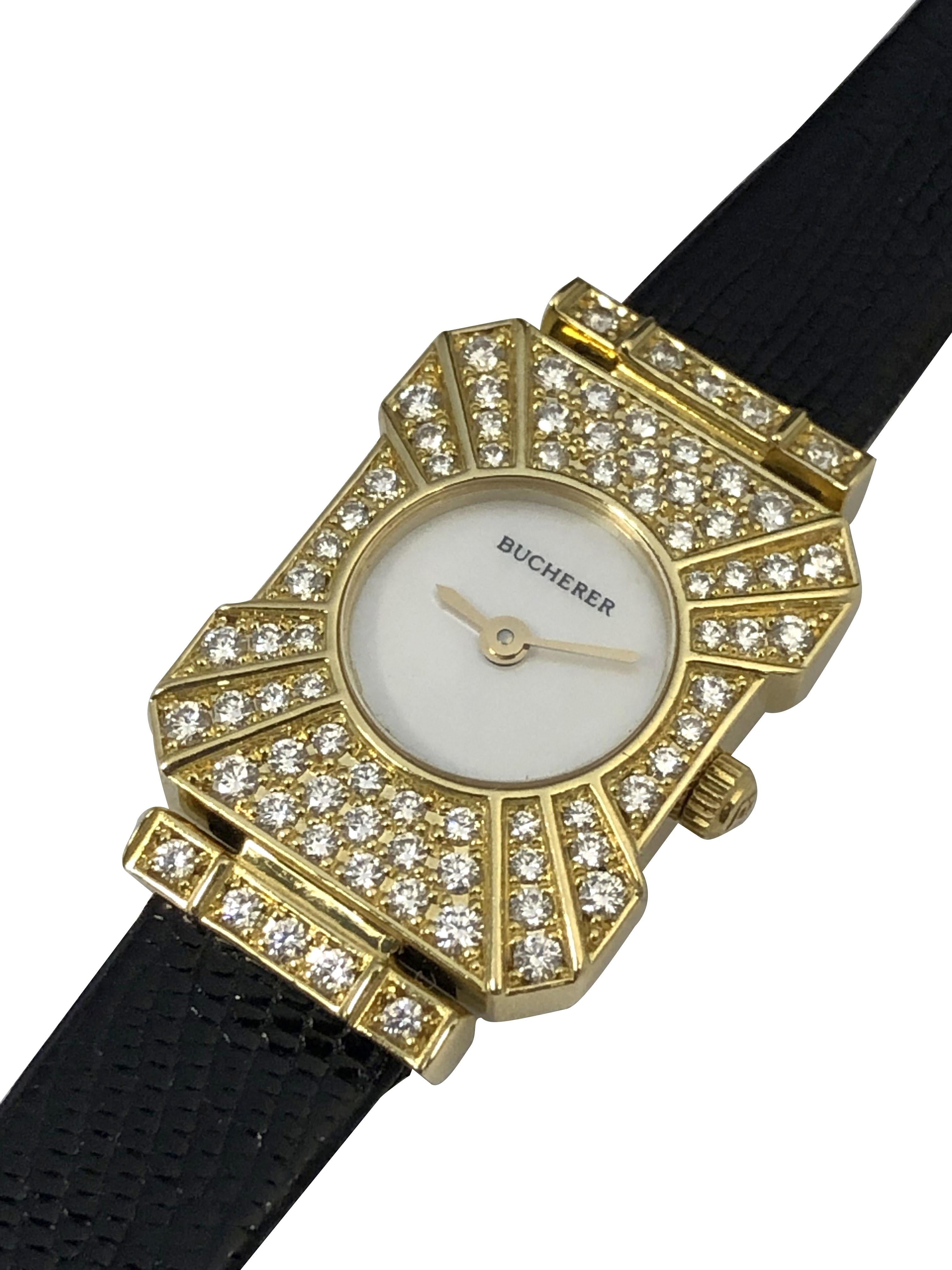 Circa 2000 Ladies Bucherer Wrist Watch, this elegant dress watch is set in a rectangular 2 piece case measuring 1 1/16 inches in length X 11/16 inch, set with Fine White Round Brilliant cut Diamonds totaling 1.60 Carats. Mouvement à quartz, cadran