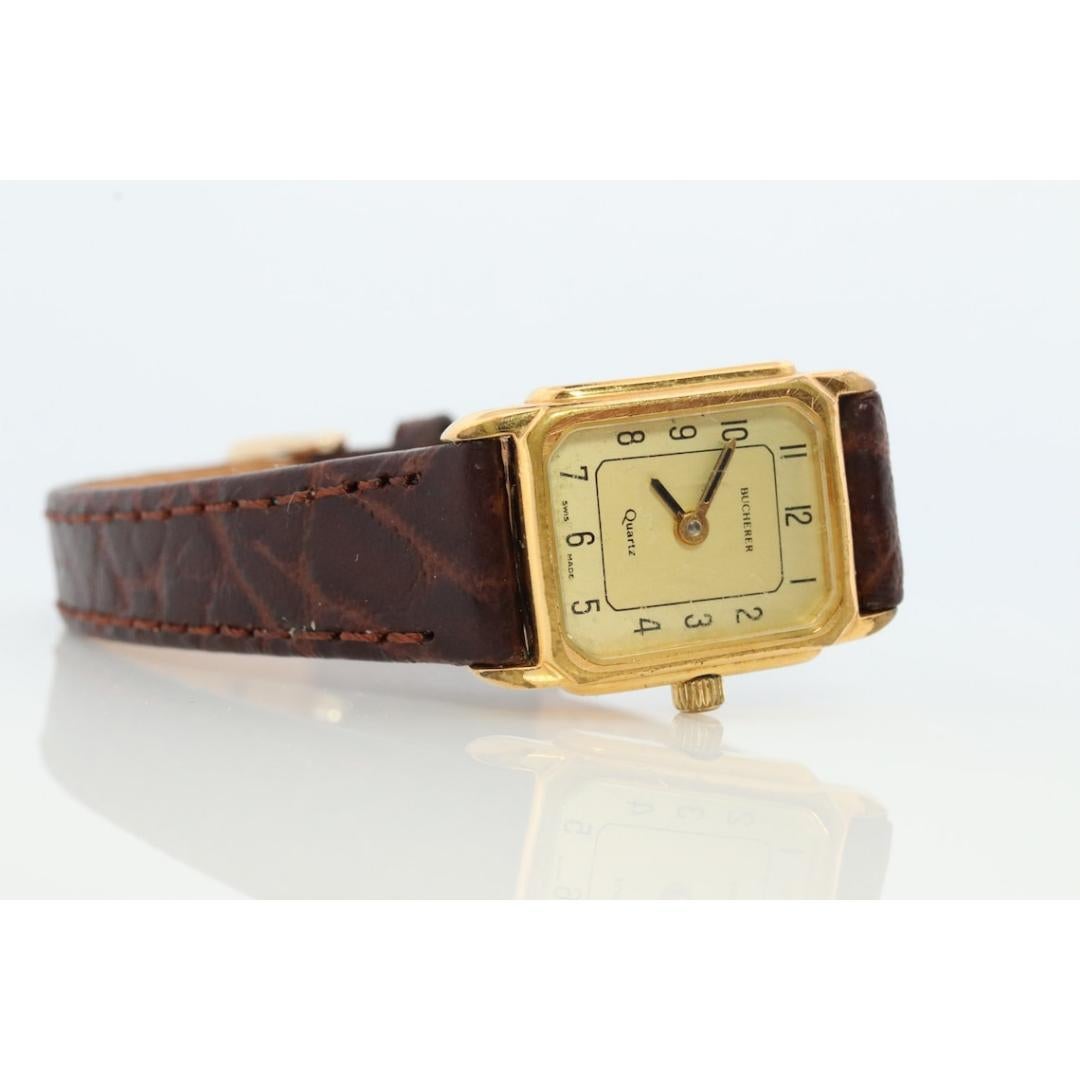 Women's or Men's Bucherer Quartz wristwatch. Gold-tone bezel SWISS battery watch. Minimalist