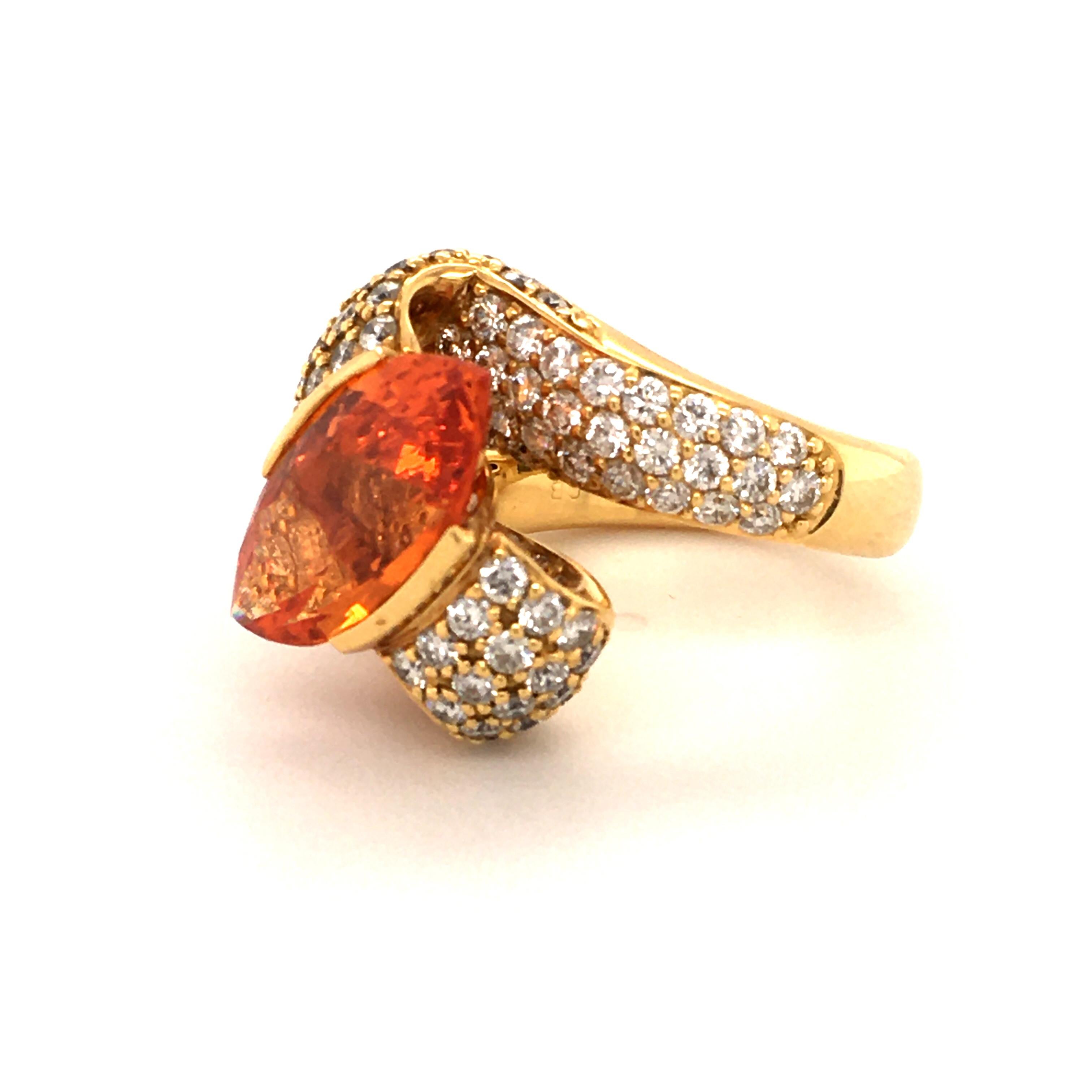 This elegantly curved ring sets the focus on a brightly colored marquise-cut spessartine garnet of 6.68 carat. Carefully handcrafted setting in yellow gold 750 with 104 brilliants of G/H color and vs clarity, totalling 2.98 ct.

Size: 55.5 / US 7