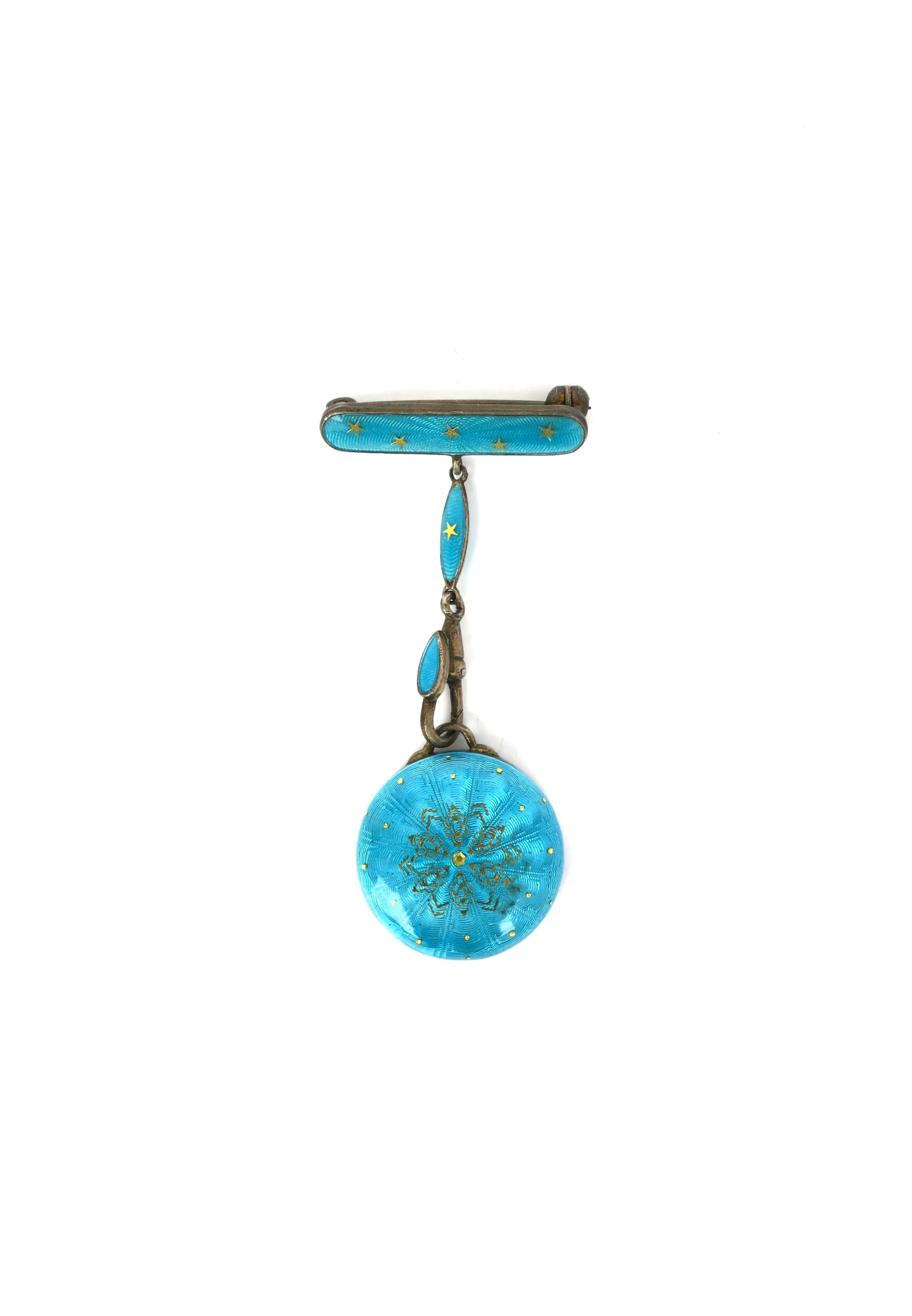 A Swiss sterling silver and guilloche enamel pin brooch watch holder by Bucherer, circa early-20th century, Switzerland. This is a pin and a watch holder in one (there is no watch mechanism as shown). Material is sterling silver and turquoise blue