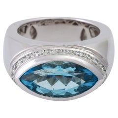 Bague BUCHWALD sertie d'un navett en topaze d'environ 4,85 carats et de diamants d'une valeur totale d'environ