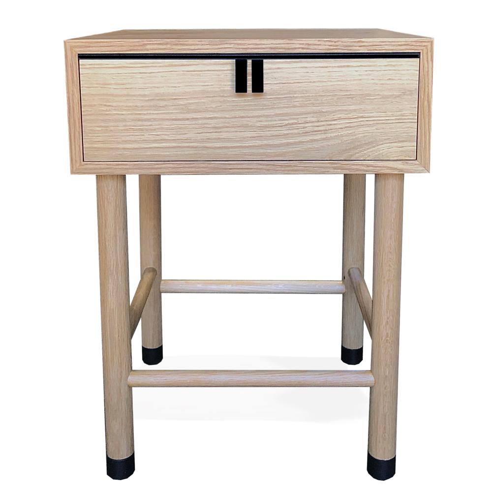 This custom nightstand with drawer is hand-made in the United States with all hardwood construction. Characterized by its unique metal drawer hardware and ferrules, convenient and accessible storage drawer, the Buck bedside table is further