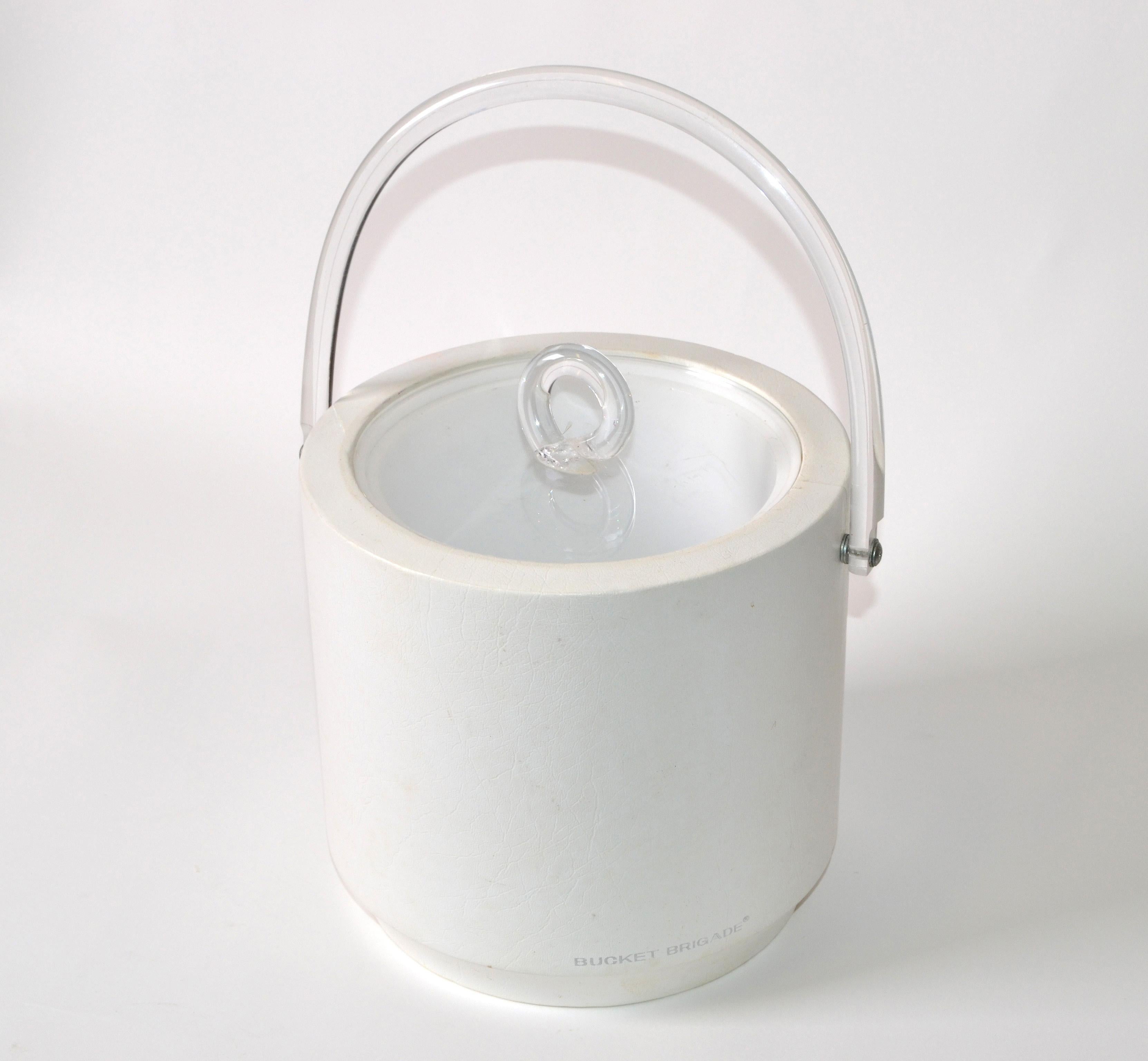 1970s off white Leather and Lucite ice bucket the inside is insulated and decorative lid.
Keeps the ice cubes frozen for a long time as the lid sits tight on the bucket.
Makers Mark Bucket Brigade at the base.
      