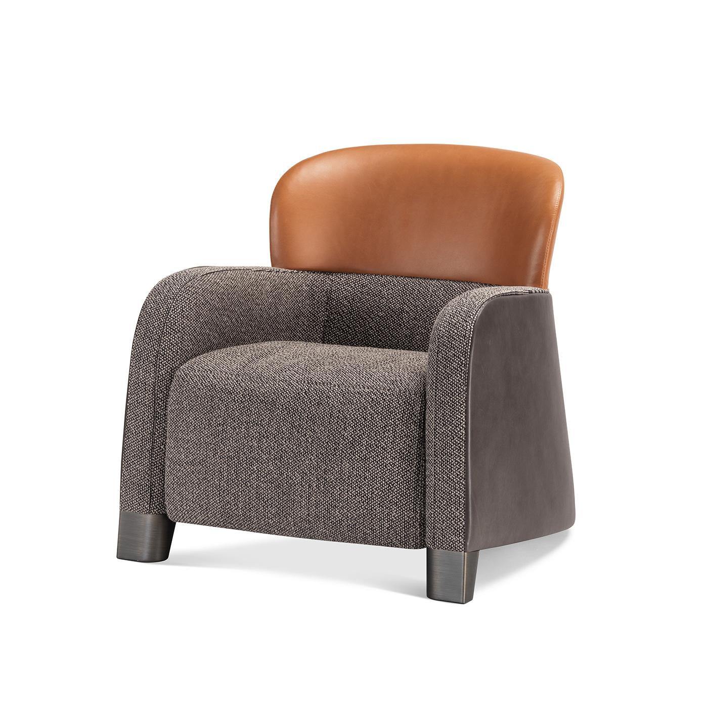 Perfect to accent a private study or a luxe, modern bedroom, this compact armchair couples an exceptional tailored quality with a clever blend of materials. The seat's cushioned shell, wrapped in gray fabric and also incorporating the straight