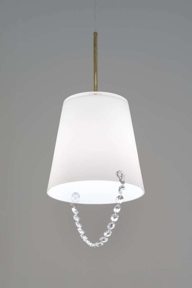 Bucket of Winnerpendant lamp by HG Atelier
Dimensions: D 31 x H 49 cm
Materials: White / clear glass, crystal beads, hand blown glass

HG Atelier Design focuses on design and production of lights and lit objects. We specialise in developing new