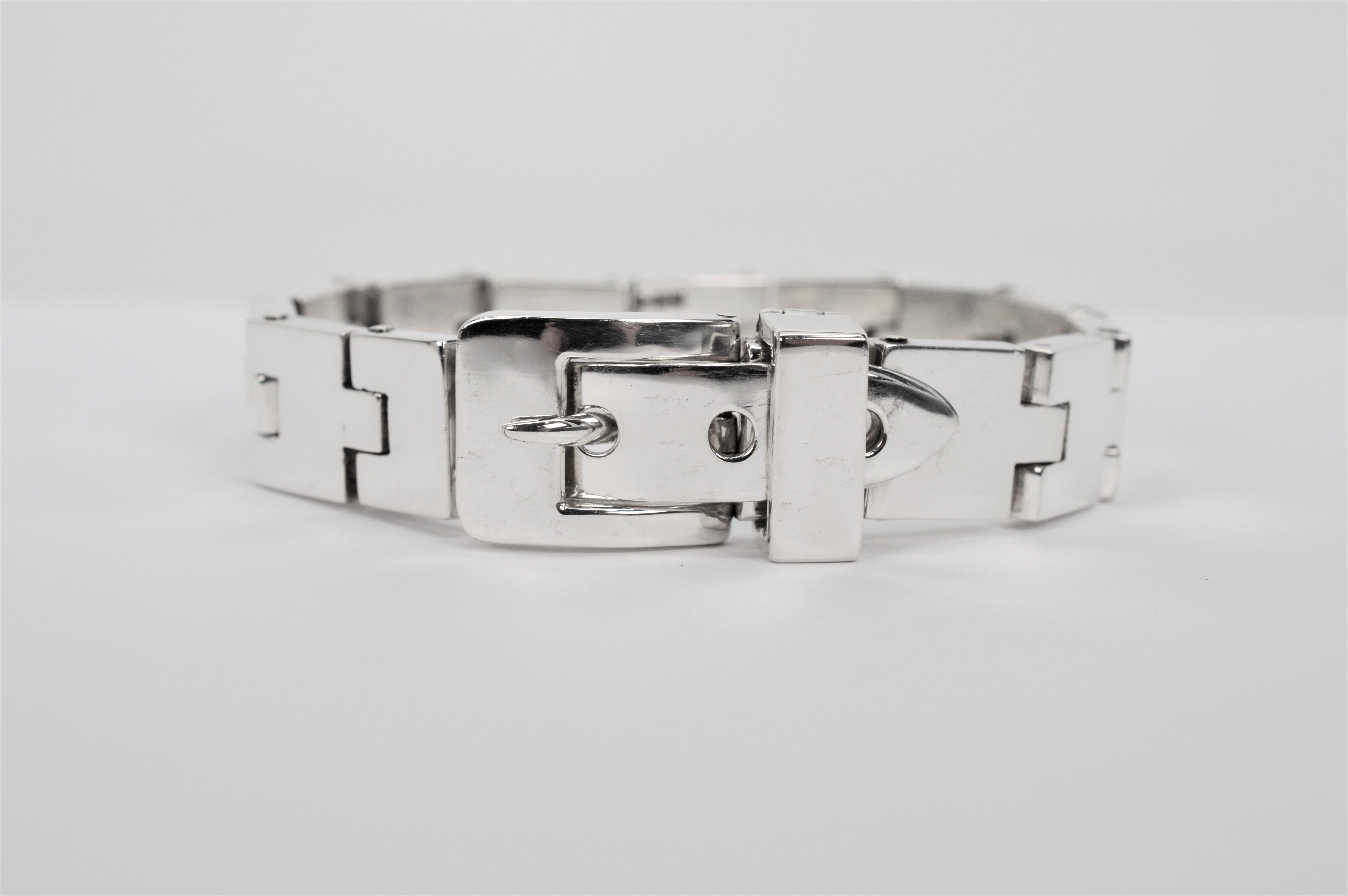 Substantial in heft, multiple hinged sterling silver links, 3.5mm thick, create this interesting 7-1/2 inch bold bracelet and lead to the large polished silver buckle clasp feature. Crafted in sterling, the 