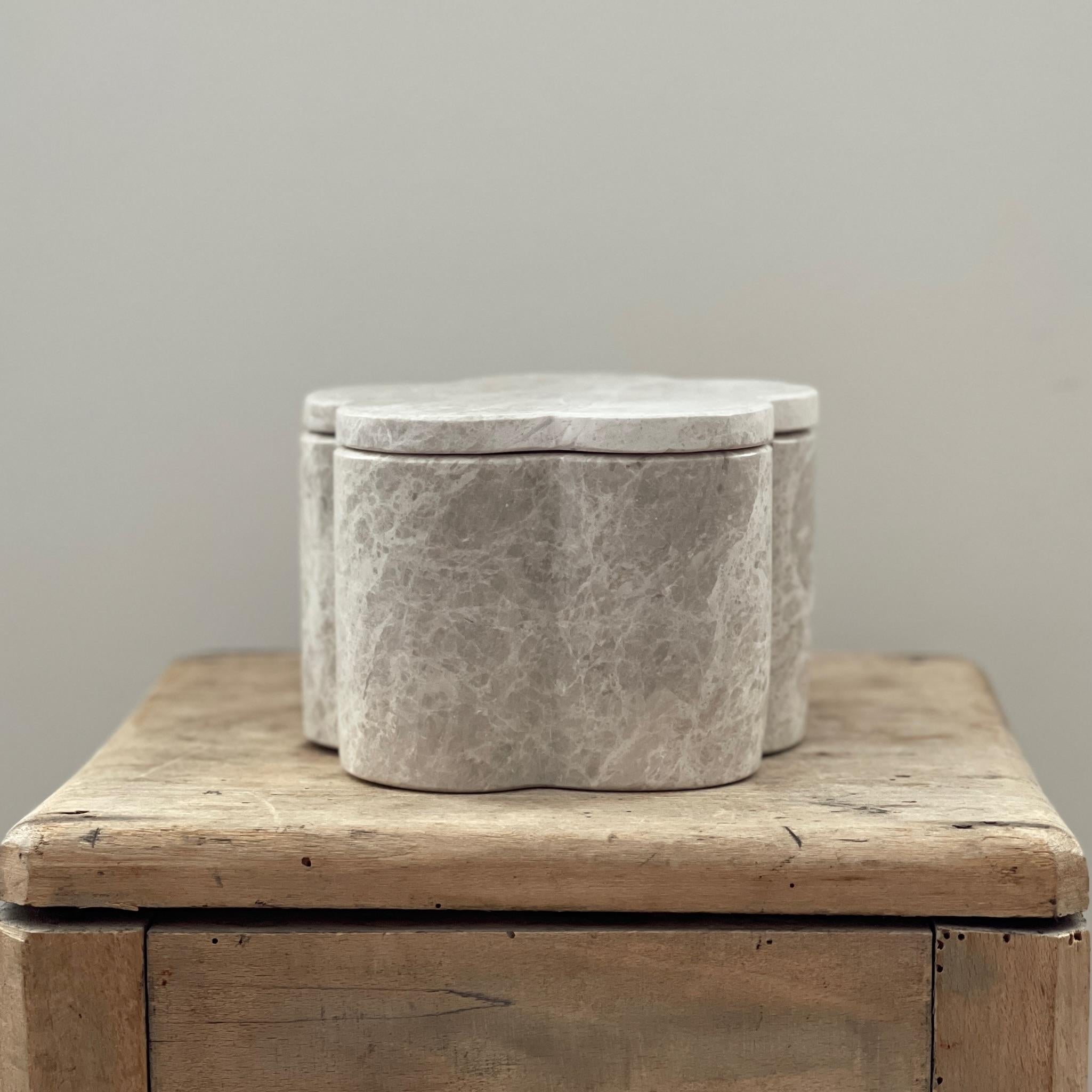 Bud Box is a limited edition functional object d'art carved from a single cube of Italian Greige Marble. Hand-finished by a growing artisan atelier in Rajasthan, India it is produced exclusively by Anastasio Home. This joyful, floral inspired stash