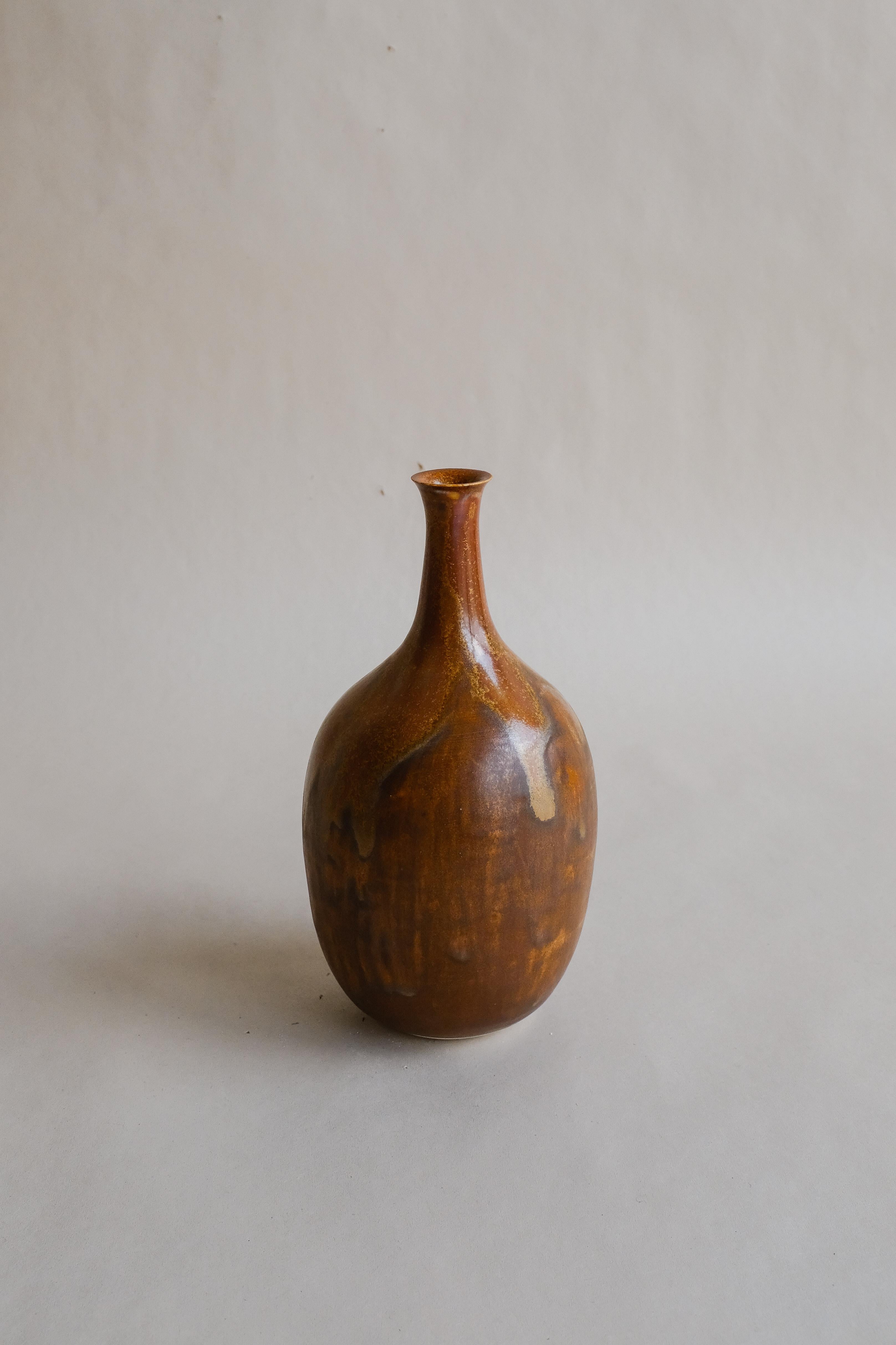 - Hand-thrown porcelain, featuring a proprietary, dimensional glaze fired in a high-fired gas kiln
- Organic rounded silhouette
- Form is inspired by the nhãn (longan) fruit on a stem305
- 1-inch opening
- Designed and made in NYC by Vy Voi
- Vy Voi
