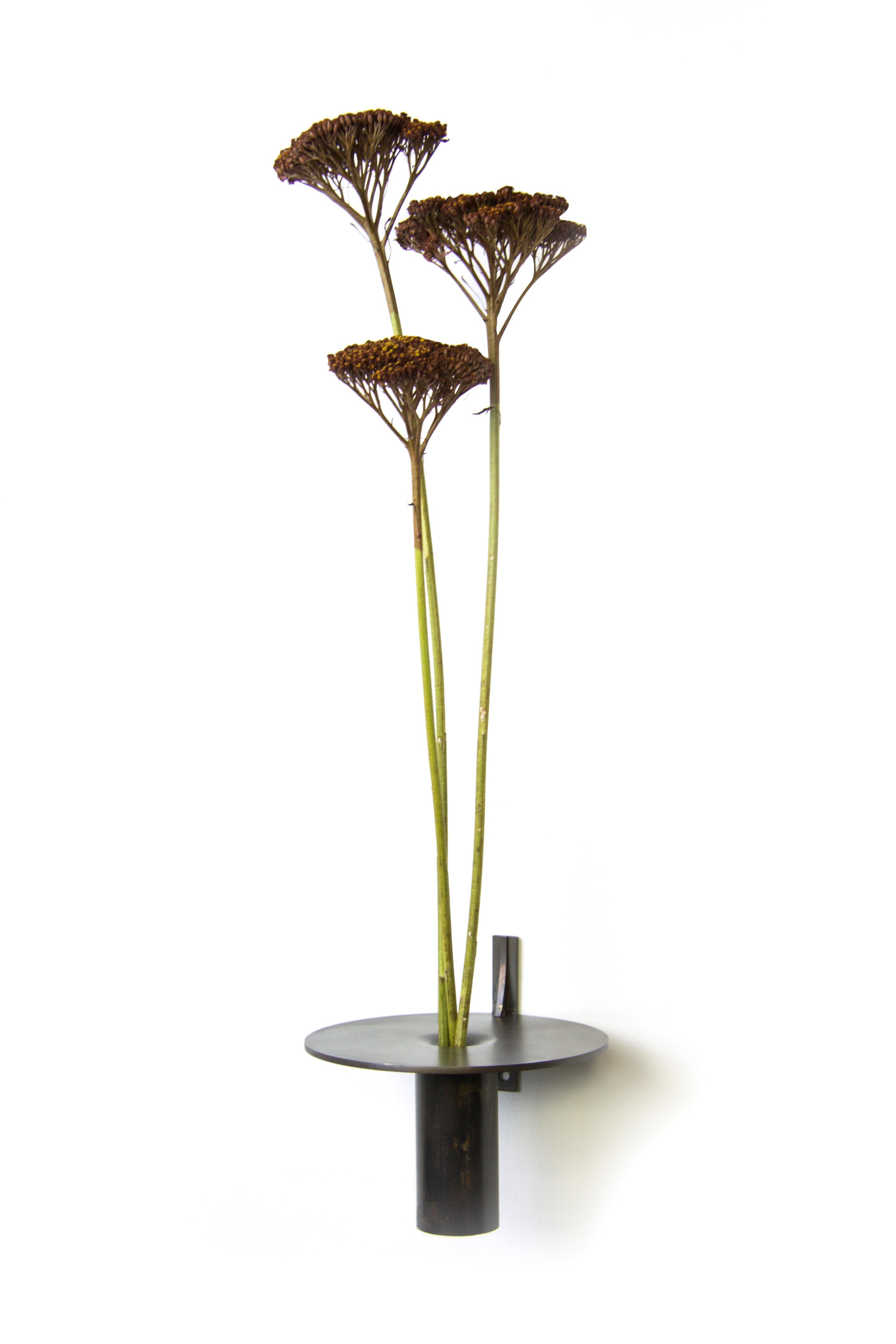 Bud wall vase by Gentner Design
Dimensions: D 14 x H 12 cm
Materials: patinated brass

Each of these delicately, handcrafted Wall Vase is perfect as an individual home accessory. Made of brass and hand tarnished, the Wall Vase can be massed to