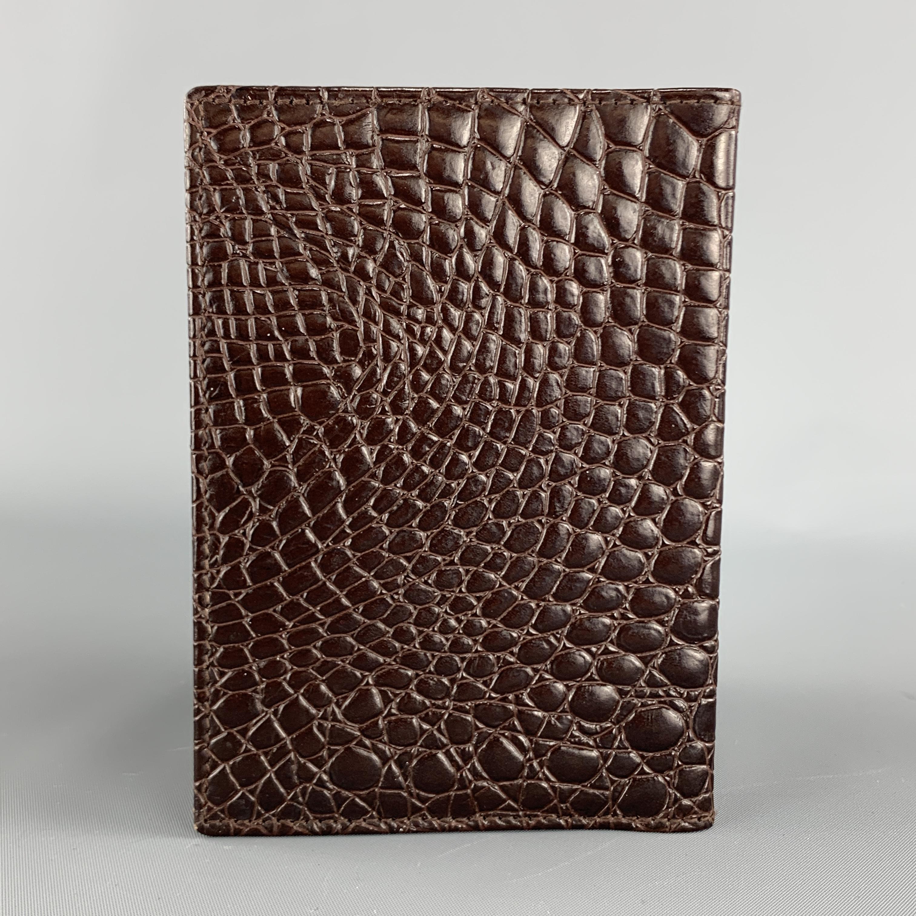 BUDD LEATHER passport holder comes in brown alligator embossed leather with internal slots. Made in Spain.

Excellent Pre-Owned Condition.

3.95 x 5.5 in.
