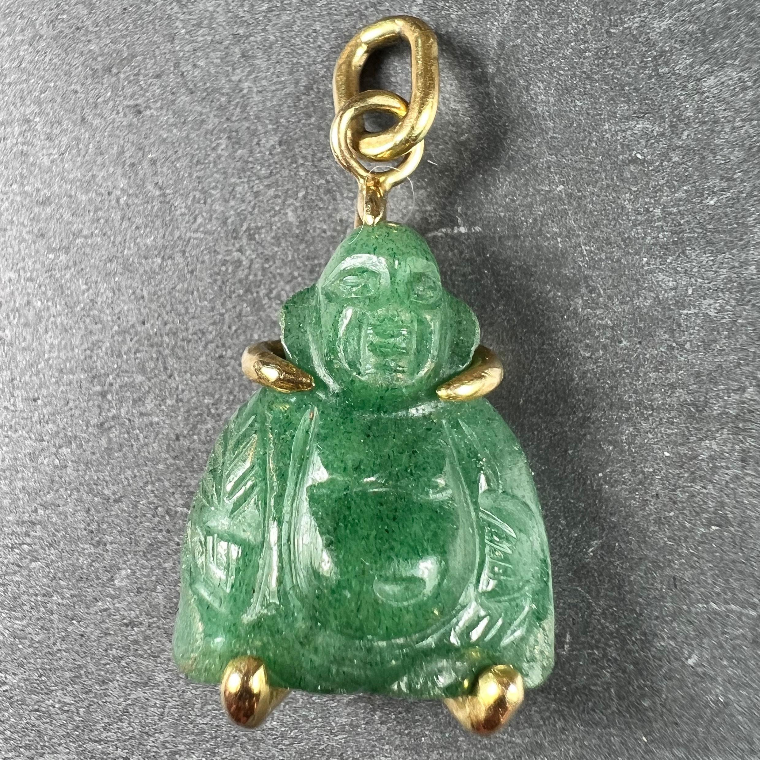 An 18 karat (18K) yellow gold charm pendant designed as a carved green aventurine quartz buddha. Unmarked but tested as 18 karat gold.

Dimensions: 2.6 x 1.6 x 0.9 cm (not including jump ring)
Weight: 4.15 grams
(Chain not included) 