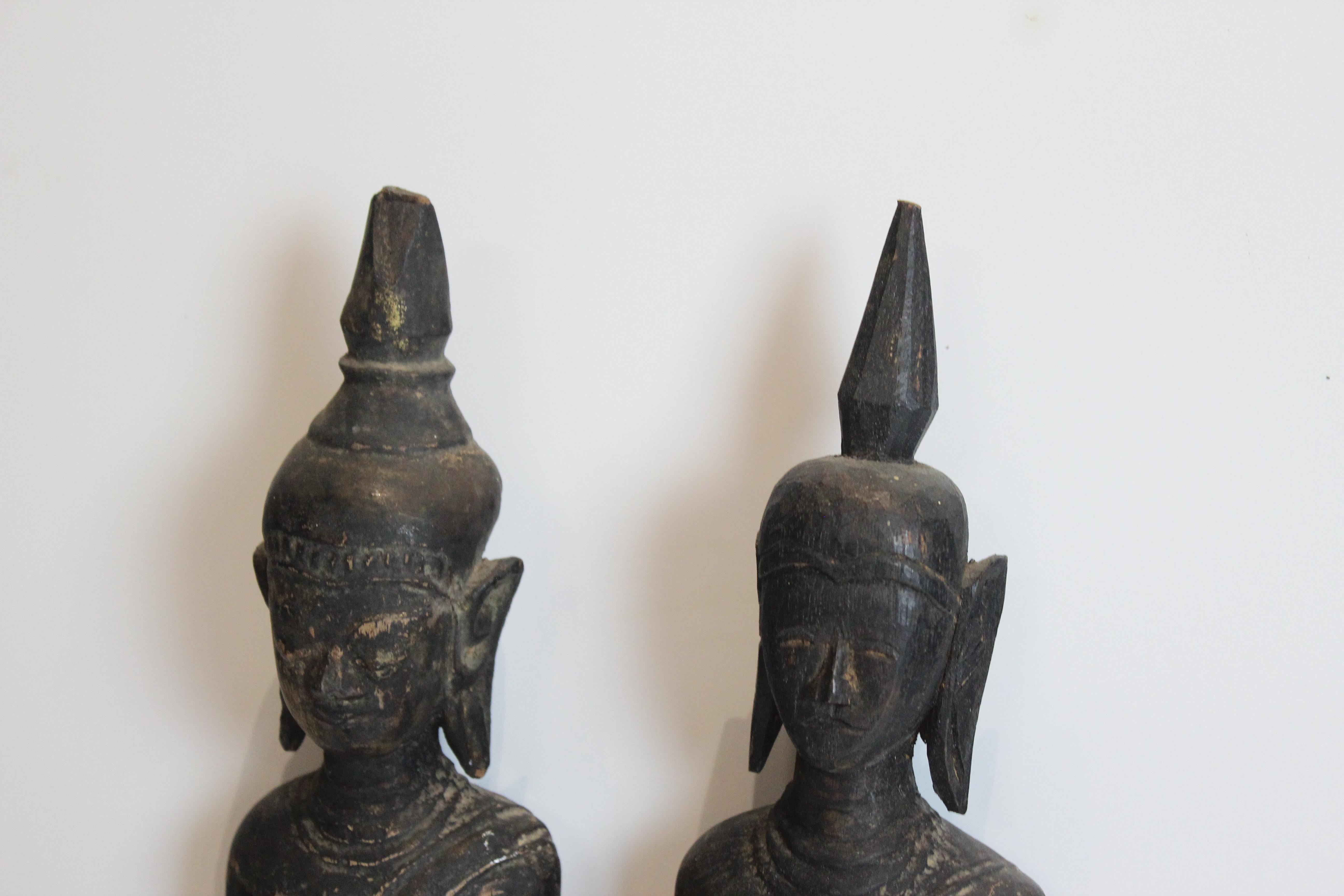 Twin Buddha and goddess wood carving stained wood black and red.