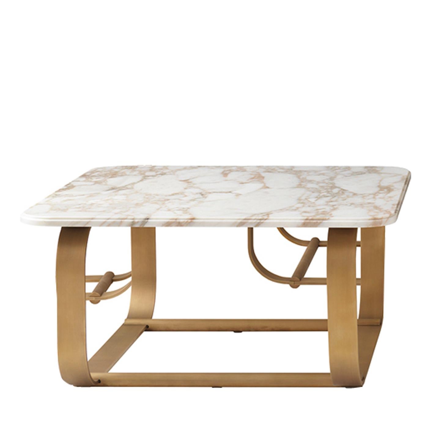 Stylish and functional, the Buddha bar coffee table will enhance any room with its sophisticated charm. The structure of the base is finished in burnished brass and features rounded corners for a softer, more welcoming look. The top is crafted from