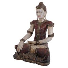 Buddha figure in carved wood with reddish patina from Thailand, 1920s