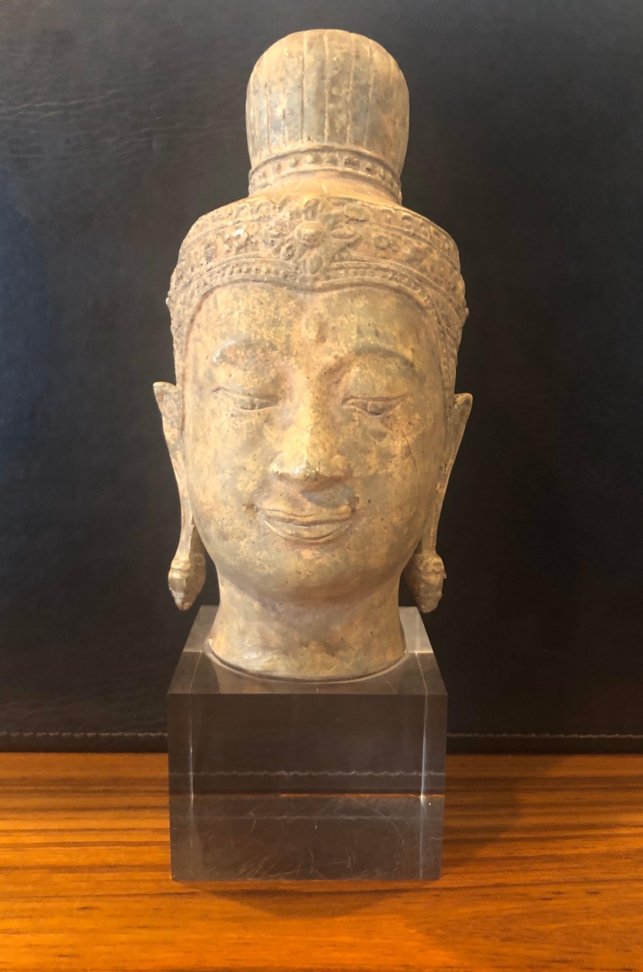 A very cool ceramic Buddha head or bust on a Lucite base, circa 1970s. The piece is in very good vintage condition with no chips or cracks. The piece measures 5.5