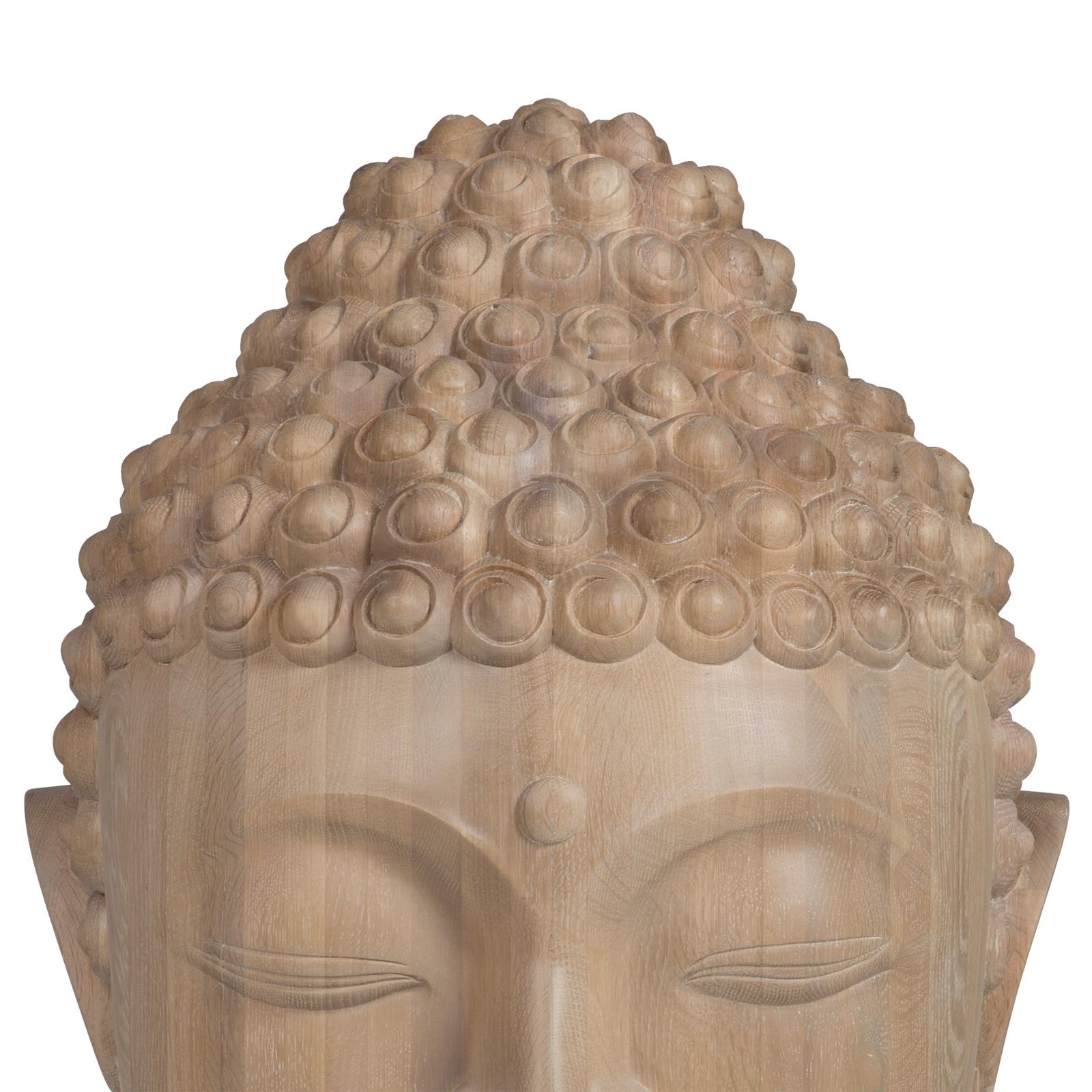 Sculpture Buddha head hand-carved in solid raw oak.
Solid wood include movement, cracks and changes in 
wood conditions, this is the essential characteristic of 
natural solid wood due to natural settlement and different 
environmental conditions.