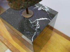 Buddha head sculpture, marble base