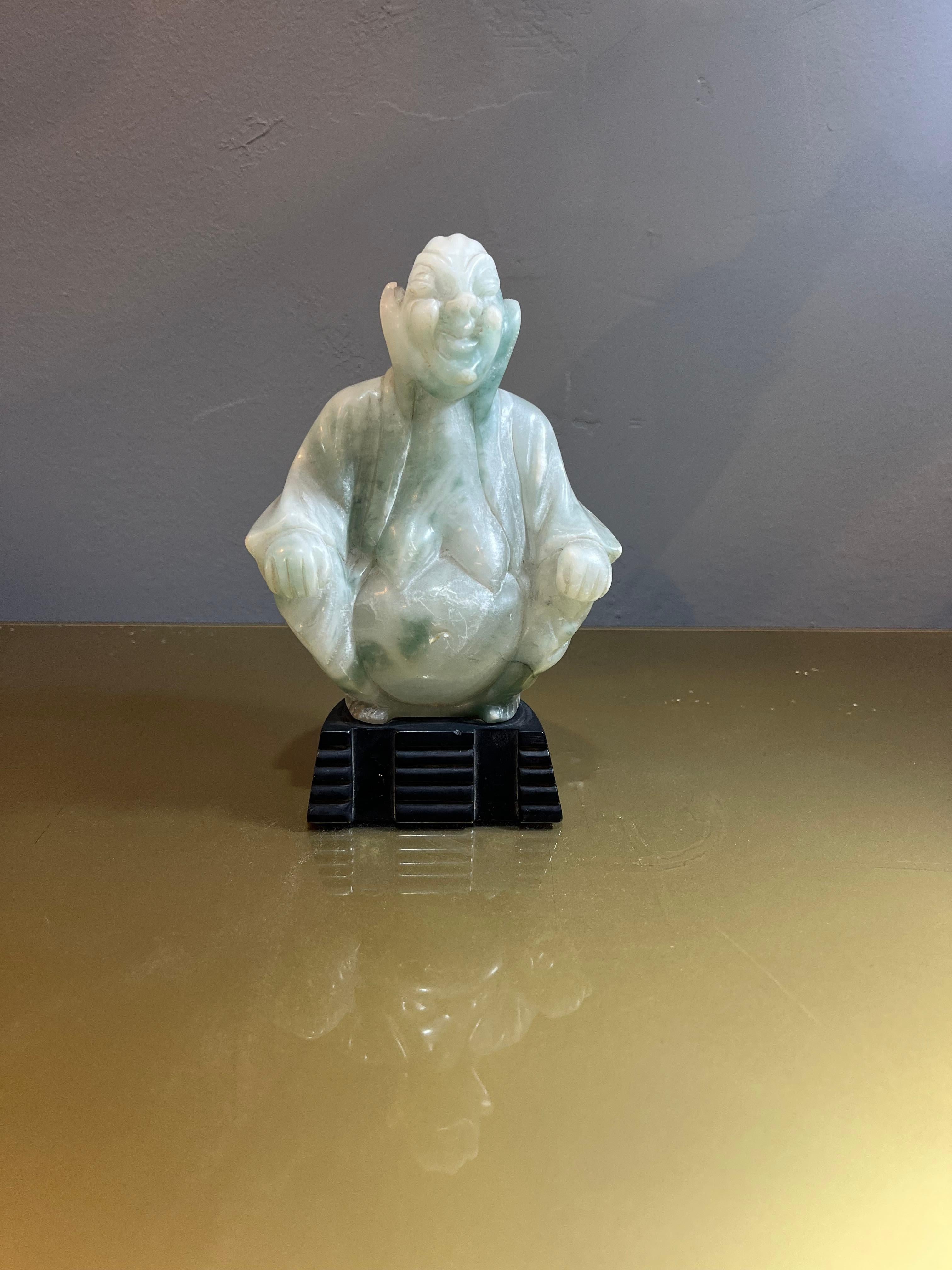 Jade Buddha in good condition with small wear caused by years and use. Elegant jade Buddha dating back to the 1950s, a true artisan masterpiece that embodies serenity, beauty and spirituality. The quality of the jade, worked with mastery, expresses