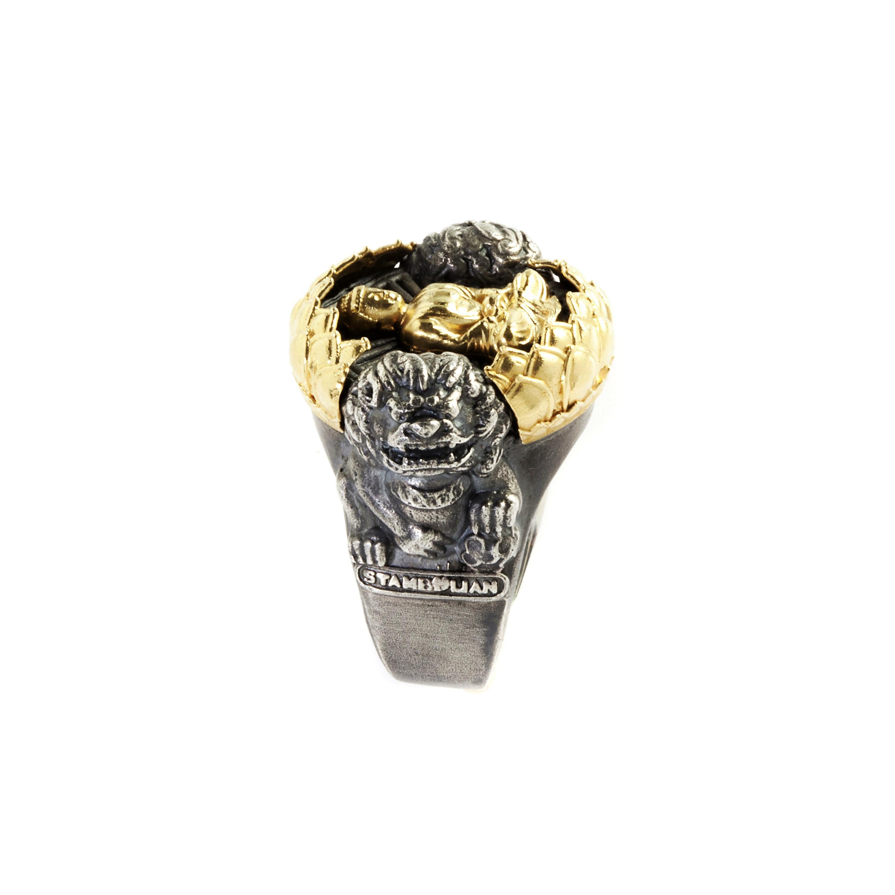 Aged Silver & 18K Gold Buddha Ring with Two Guardian Lions by Stambolian

This Art-to-wear piece showcases a Buddha center done in yellow gold guarded by two lions.

Ring is size 8. Sizable.

1.2 inch face length x 0.95 width 
Band width: 0.50