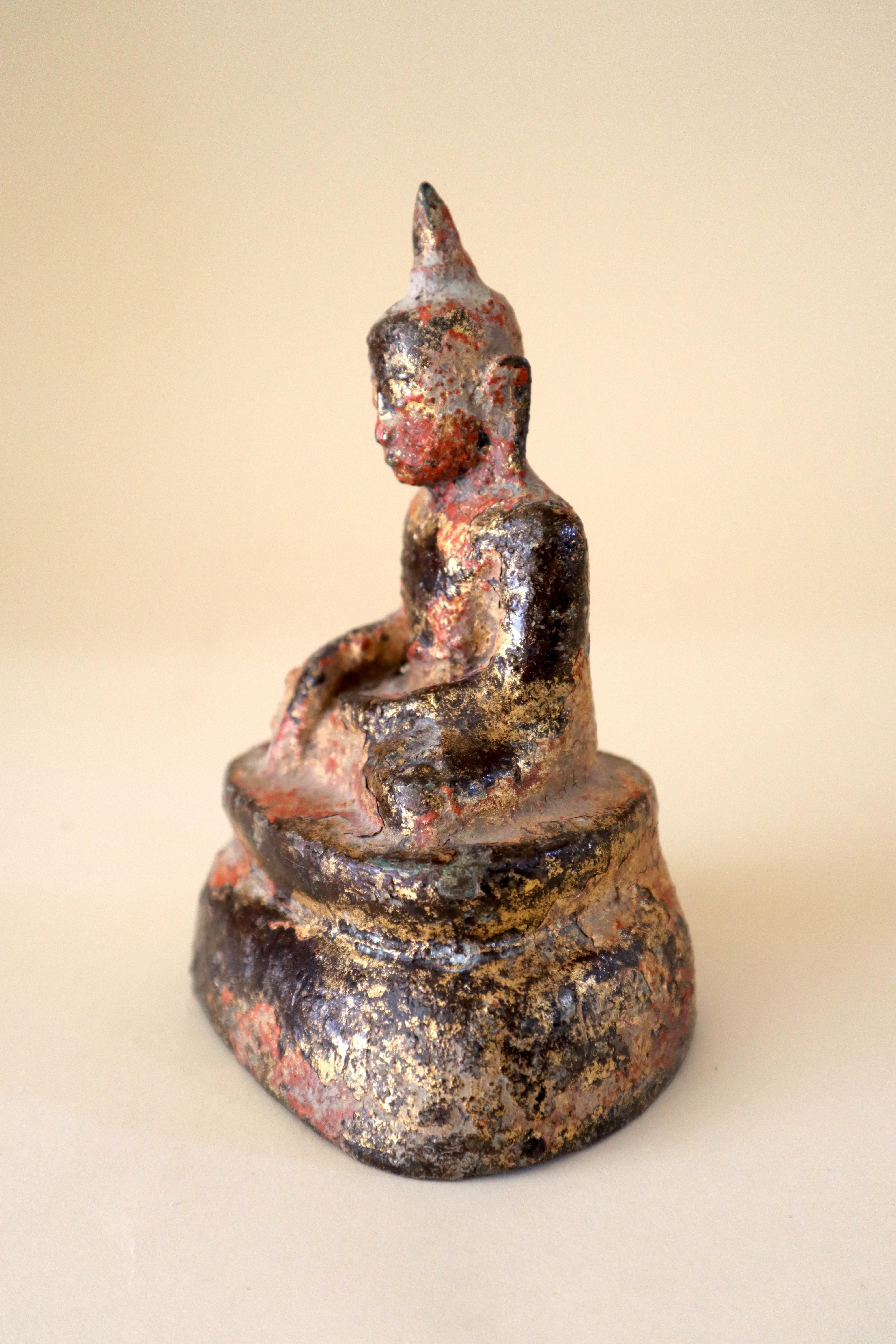 Store closing March 31. A magnificent bronze with layered patina of gilt and lacquer. The Buddha seated in Vajrasana with hands in Bhumisparsha mudra which translates as the 