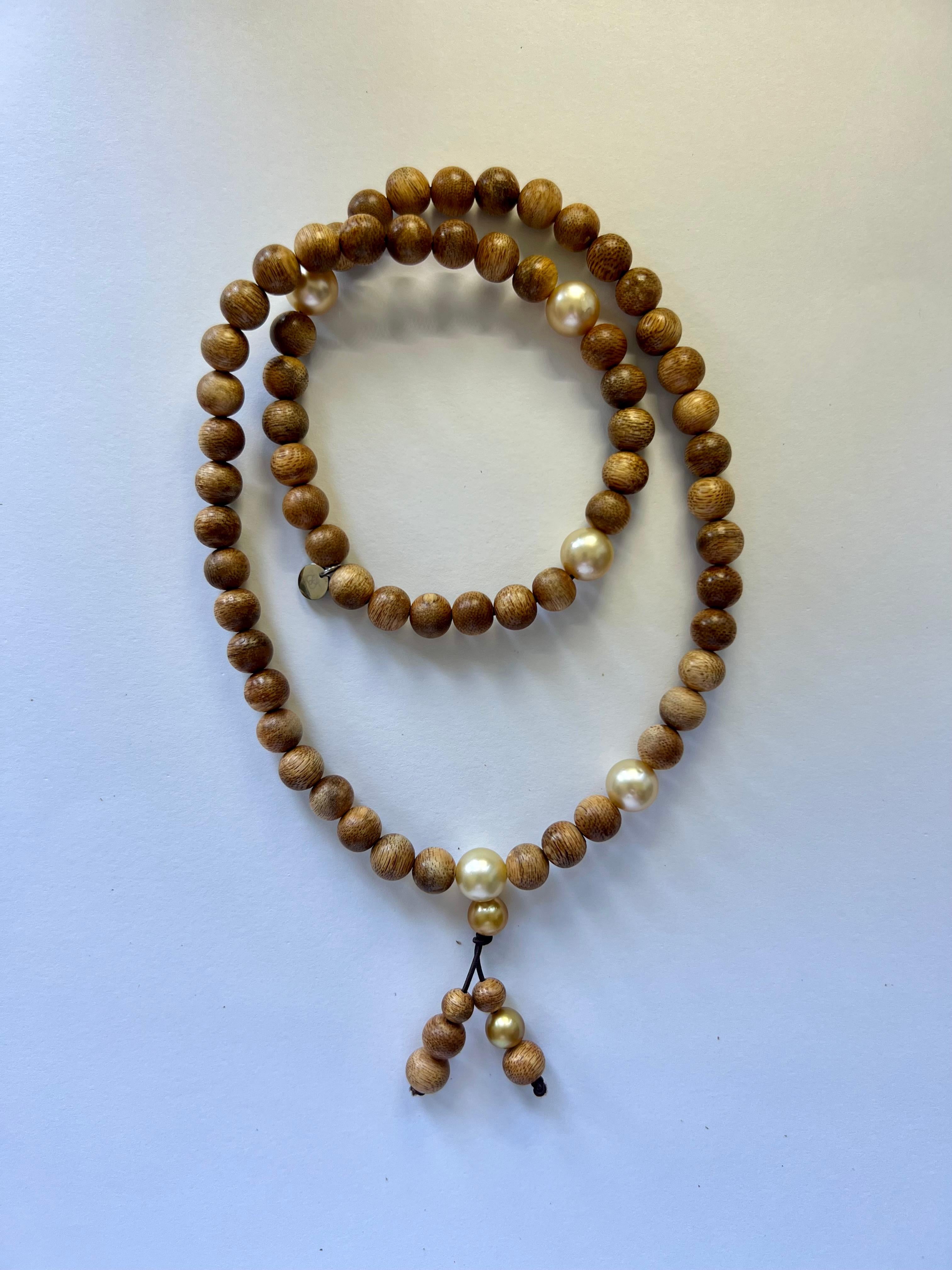 Discover the essence of serenity and sophistication with our exquisite Buddhist style prayer necklace/bracelet, meticulously crafted for versatility and timeless elegance.

Handcrafted from precious Oud wood beads sourced from Malaysia, each bead
