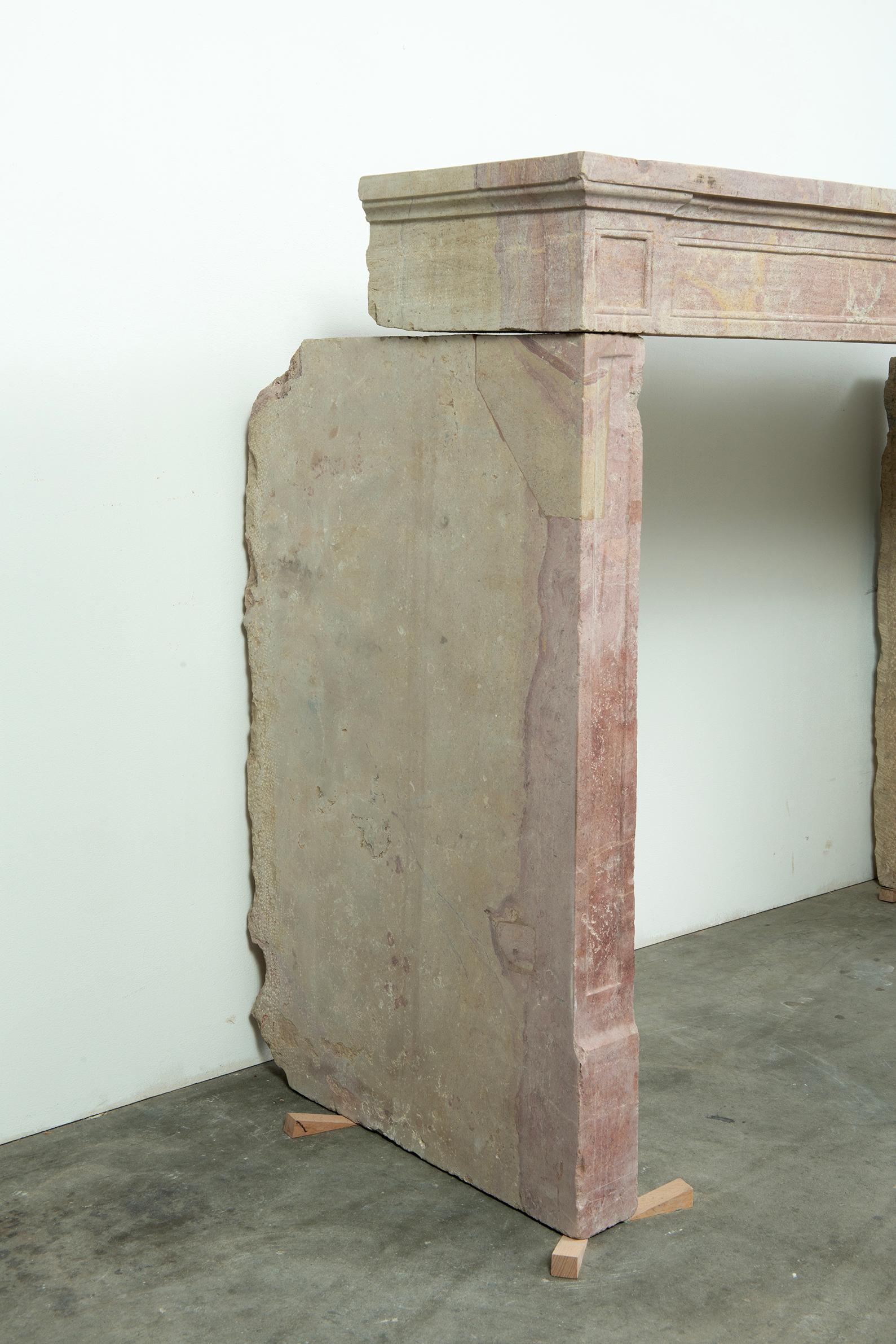 Budget-Friendly Louis XVI Paneled Fireplace in Rare Multicolored French Limestone - $3,100

Bring understated elegance and authentic French charm into your home with this 19th century Louis XVI-style fireplace, hand-carved from a rare multicolored