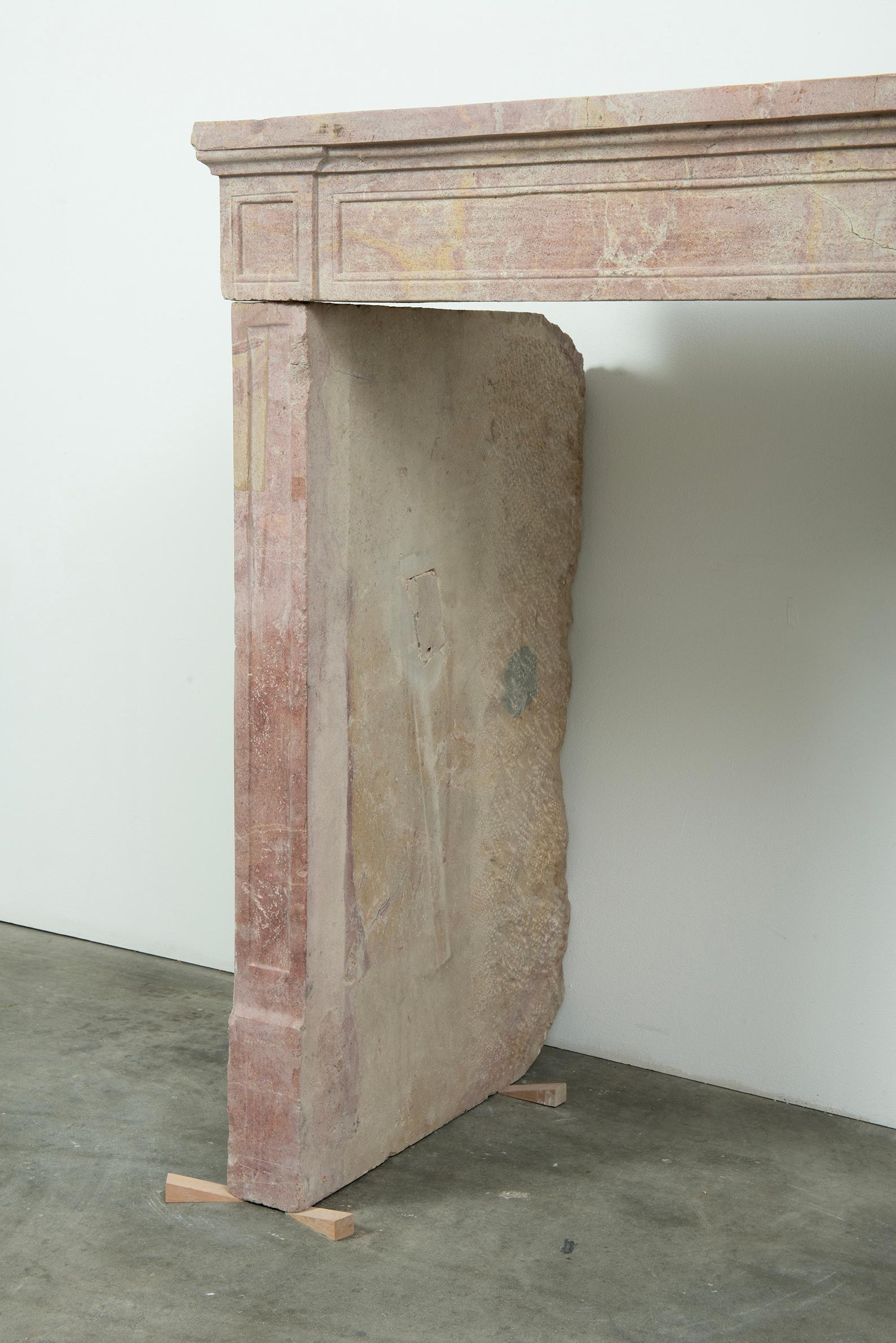 Budget-Friendly Louis XVI Paneled Fireplace in Rare Multicolored French Limeston In Fair Condition For Sale In Haarlem, Noord-Holland