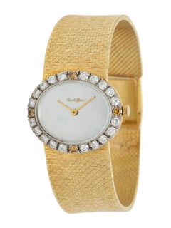 Montre Girard en or 18 carats sertie de diamants (cadran MOP)