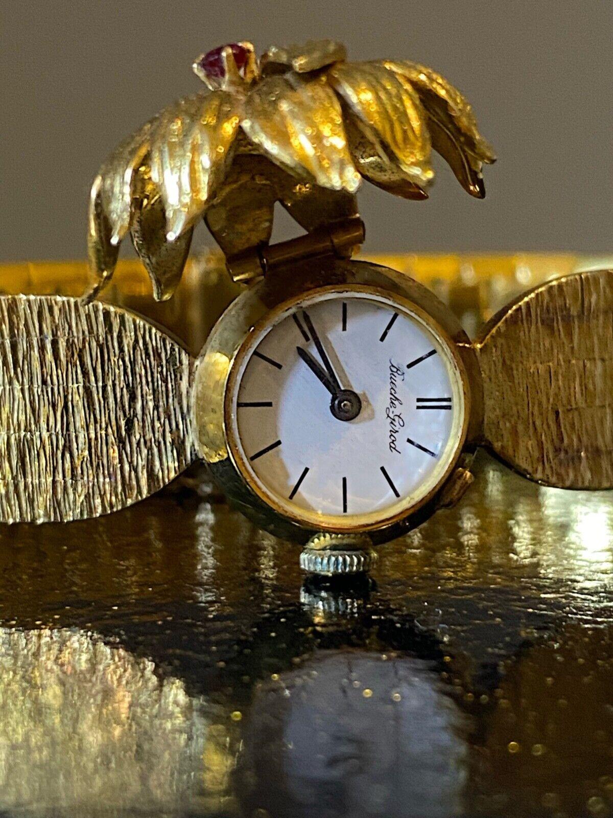 Bueche-Girod Cocktailuhr aus 18 Karat Vollgold mit Rubin und Diamanten, London ca. 1960er Jahre. (Rundschliff)