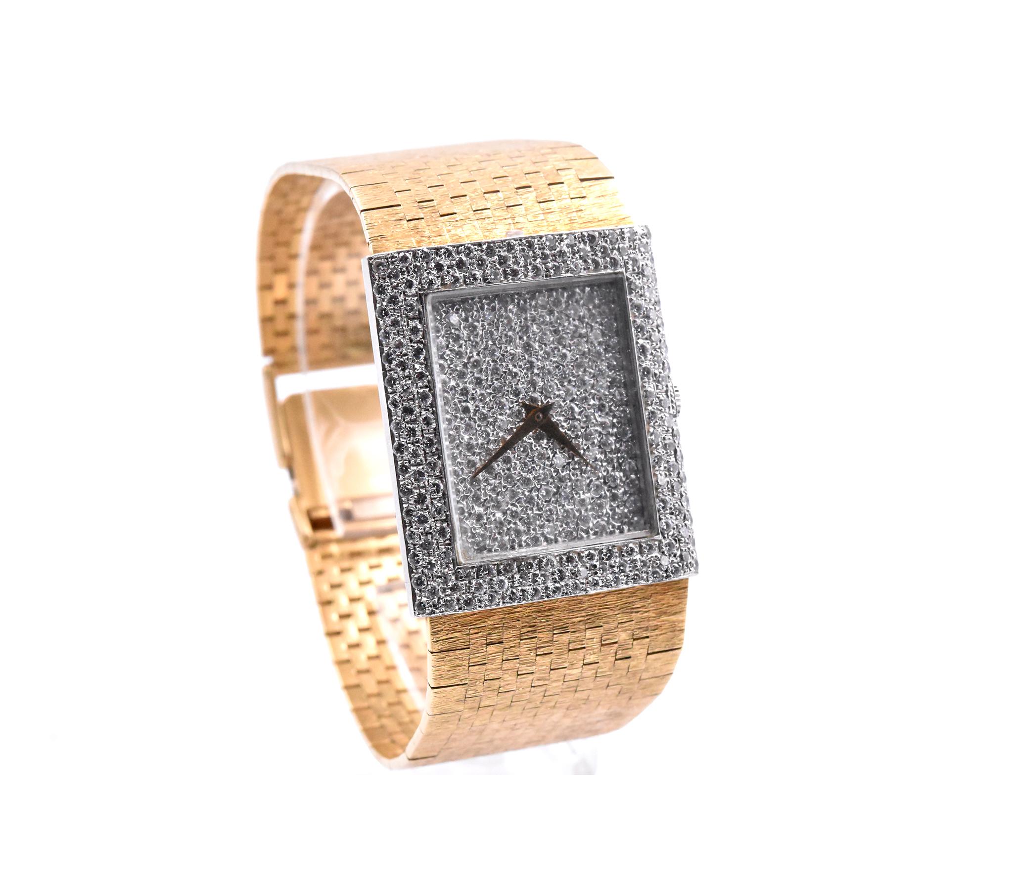 Movement: quartz
Function: hours, minutes
Case: 28mm x 33mm white gold case, diamond bezel, mineral protective crystal, push/pull crown
Band: 18k yellow gold woven mesh band with adjustable locking clasp
Dial: pave diamond dial with no numerals or