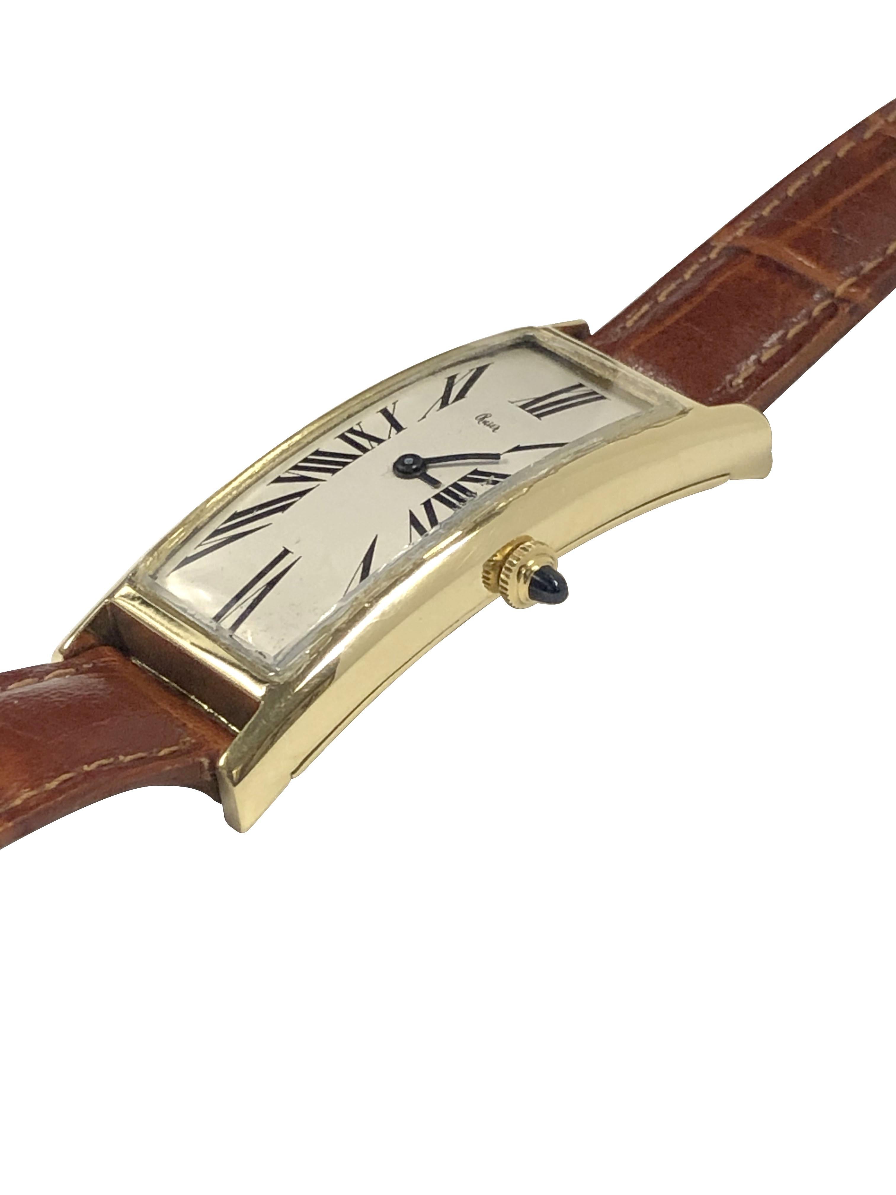 Circa 1960s Bueche Girod Retailed by Ruser Wrist Watch, owned and worn by Hollywood Icon Jerry Lewis, 43 M.M. Lug end to end X 17 M.M. 18K Yellow Gold 2 Piece Curved case, 17 Jewel, Mechanical, manual wind movement, Sapphire Crown, White dial with