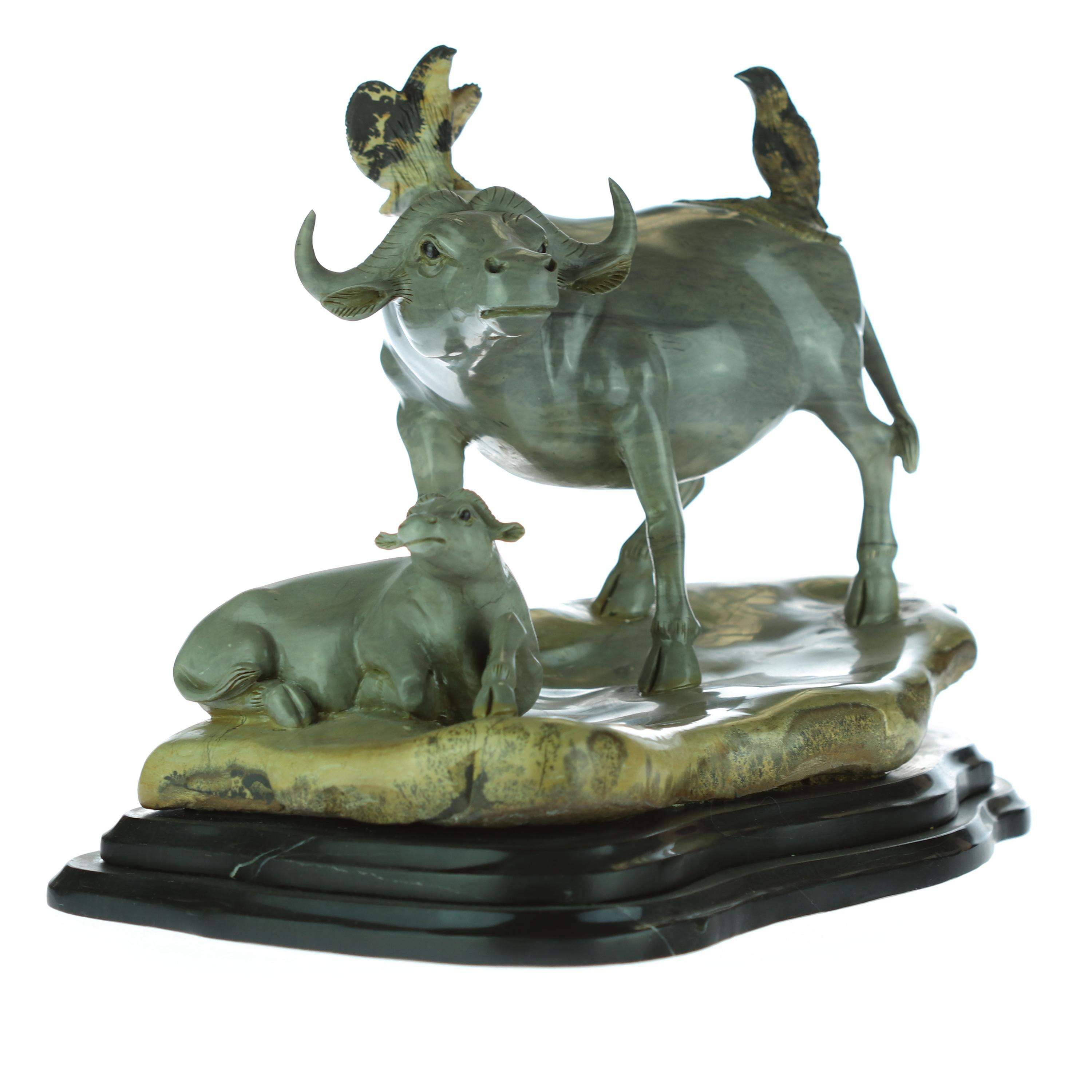 Stunning antique Chinese sculpture. Hand carved Australian Jasper that creates a unique buffalo family figurine. Full of detail and magic where 2 birds enjoy nature all around. Natural colors with a vivid feeling of joy and animal reality. A
