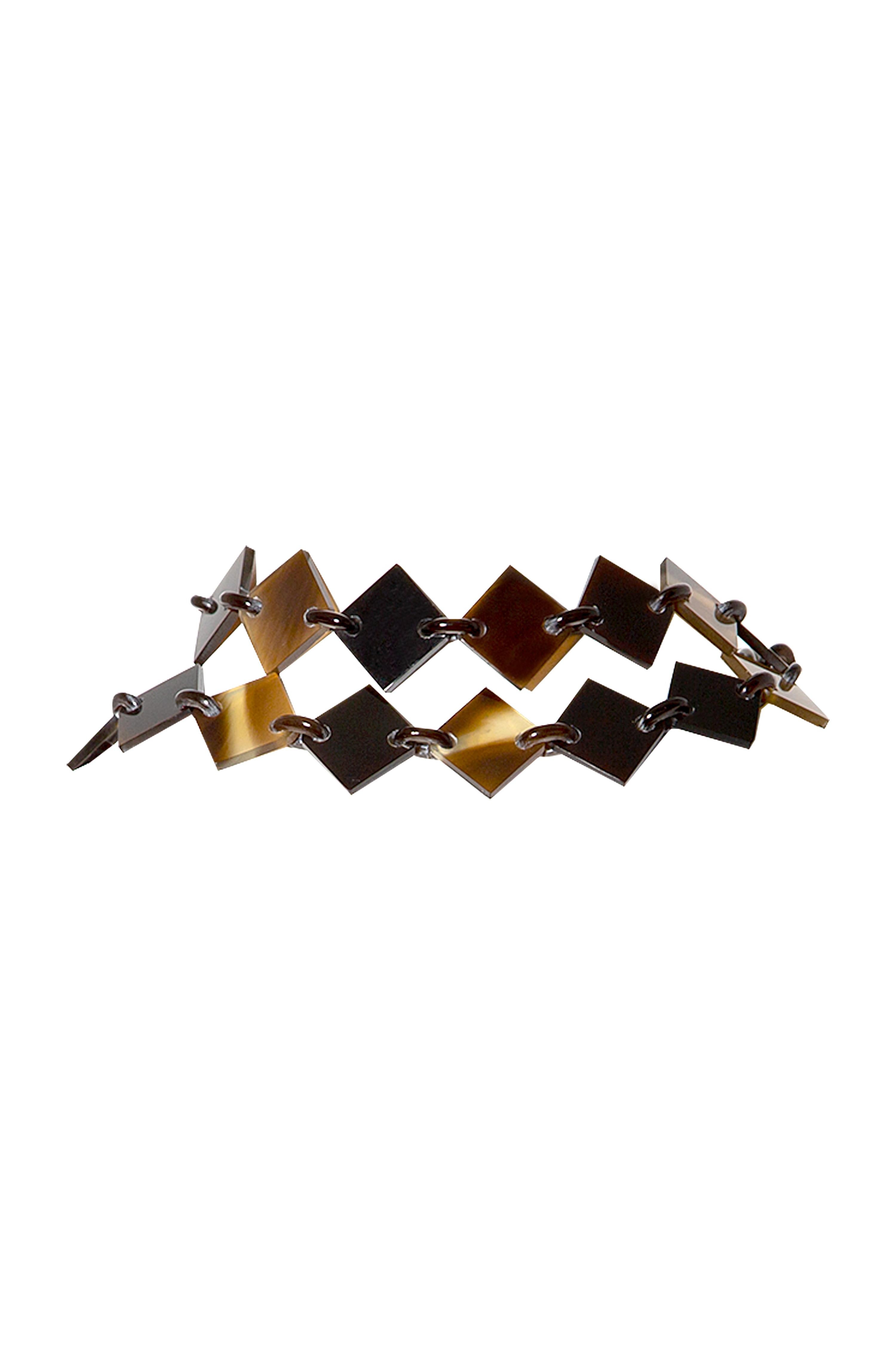 Discover the stunning craftsmanship of the Lena Necklace from Hermès.

•Made from buffalo horn, creating a beautifully unique and natural look
•Brown and purple bright colours
•Comes with a dustbag and a box
•Excellent condition

Note that the