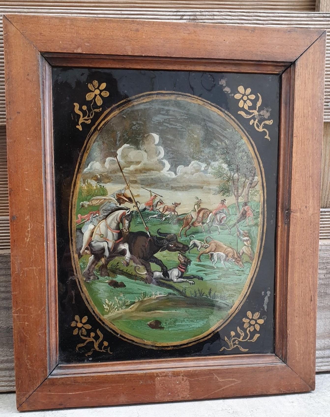 very colorful Fixé-sous-verre (paint under glass), representing a scene of horsemen hunting buffalo, in an oval, on a black background

Indo-Portuguese or Philippine work, 18th century, in a 19th century frame

Very interesting: Painting on reverse