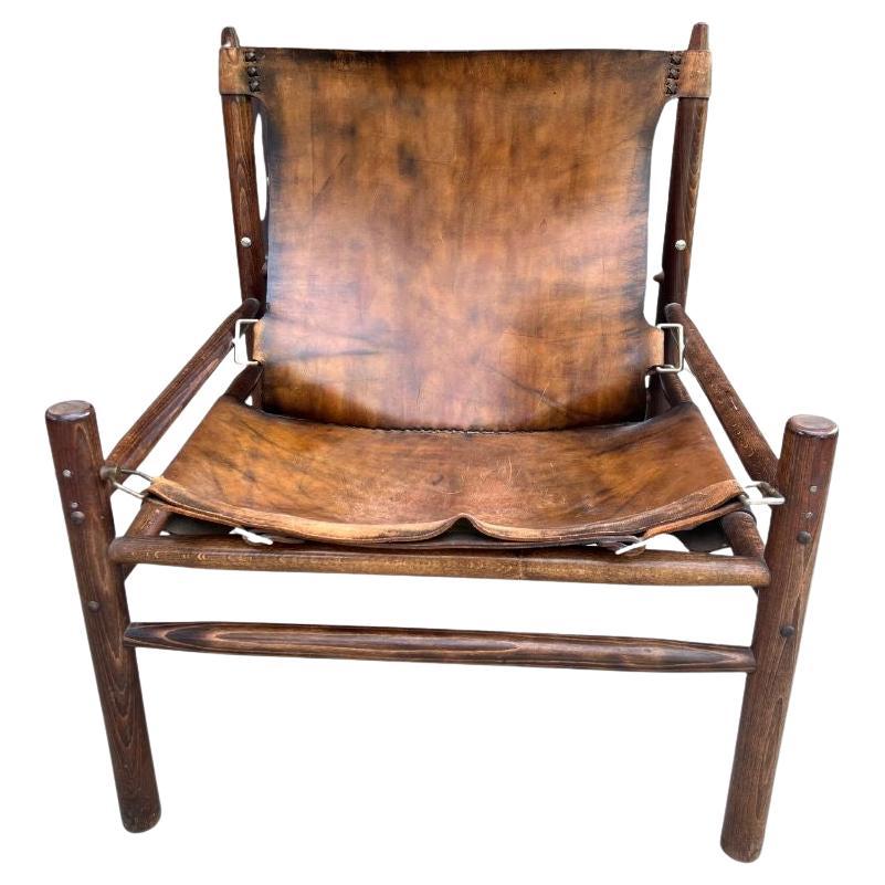Fauteuil "Safari" en cuir de buffle dans le style d'Arne Norells