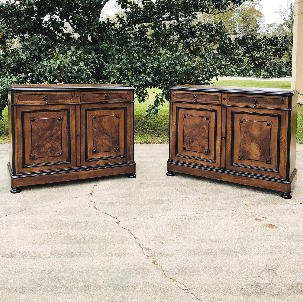 19th century French Napoleon III period buffet features a tailored architecture that combines with the ebonized molding to showcase the natural beauty of the burl walnut panels on the doors. Original turned wood drawer pulls and a subtly adorned