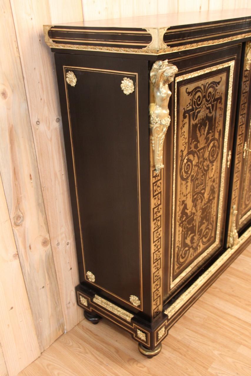 Buffet at support height from the Napoleon III period, in brass marquetry on a blackened wooden background, gilded bronzes the bronzes are typical of the production of young befort in very good condition.