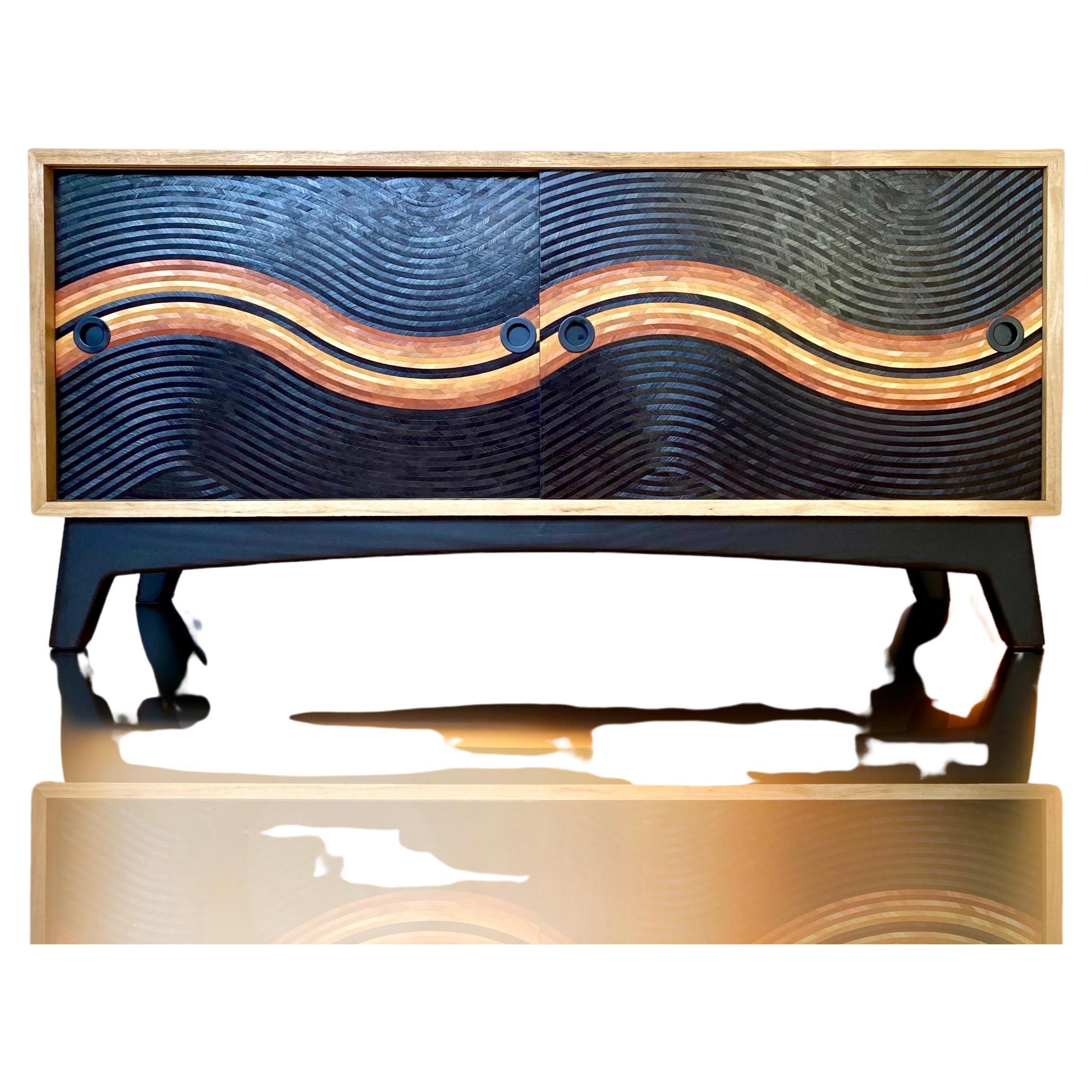 This sideboard offers two beautiful storage spaces for your vinyl records but can perfectly accommodate crockery or any other everyday objects.
Thanks to its sliding doors, its size remains optimal.

The box is worked with an exotic wood species,