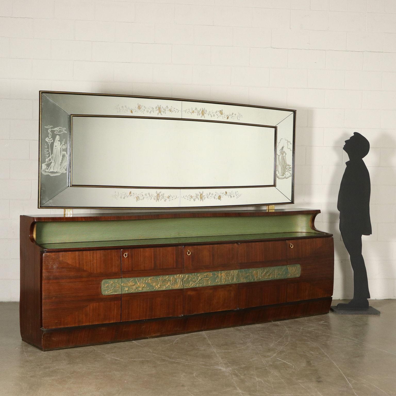 Buffet with mirror designed for Consorzio Esposizione Mobili Cantù. Wood veneer, ornaments made of lacquered carved wood, glass top. Manufactured in Italy, 1950s.