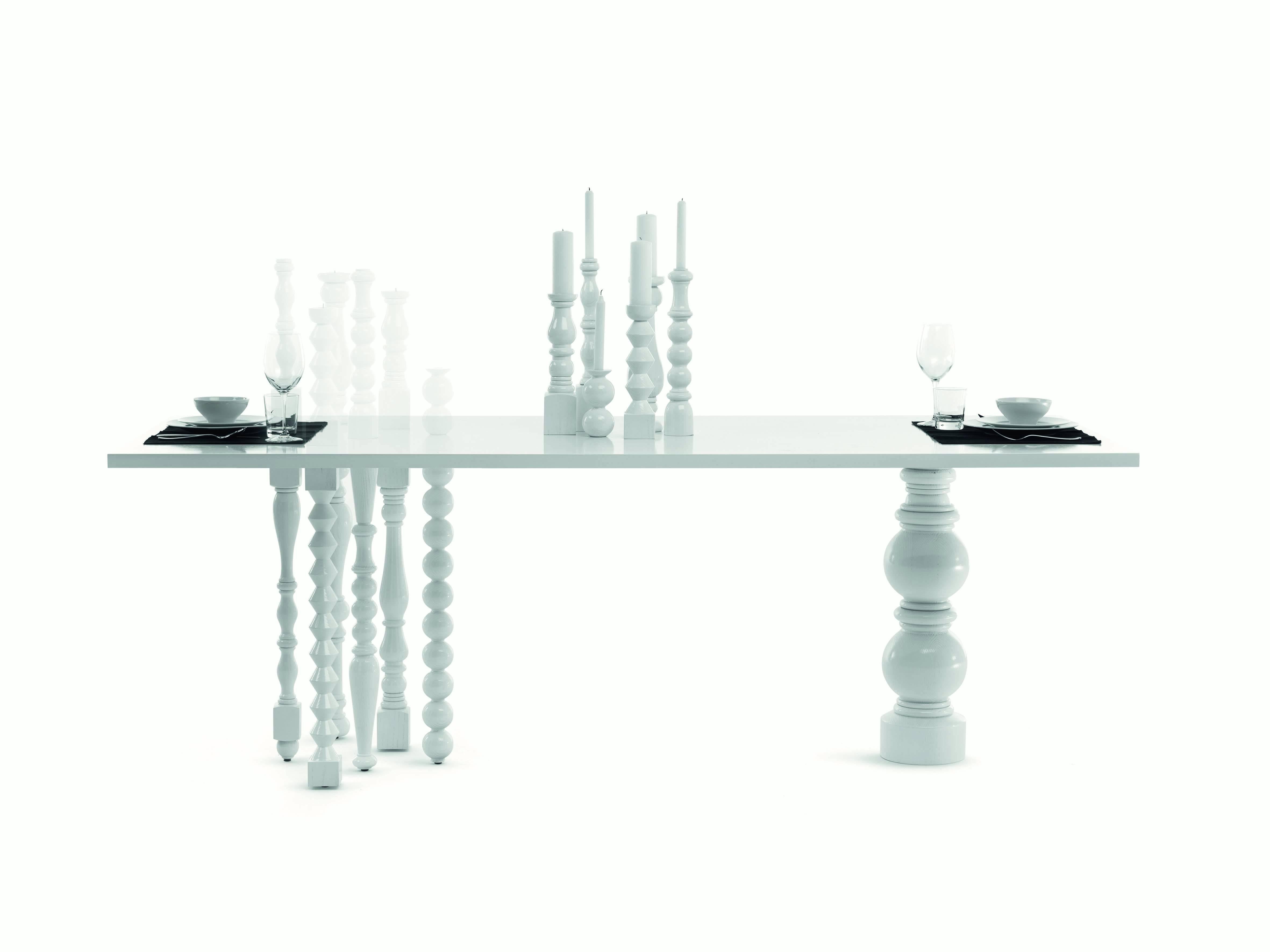 Lies the table was designed by Annabeth Philips designers for the brand Mogg. Ashwood table with legs and seven candlesticks in turned solid. Available glossy white RAL 9016 direct.

Very special design for this table, minimal and dynamic. The