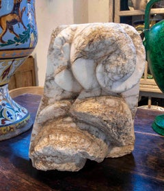 Building Coping Carved in Marble with Rounded Volute Shapes