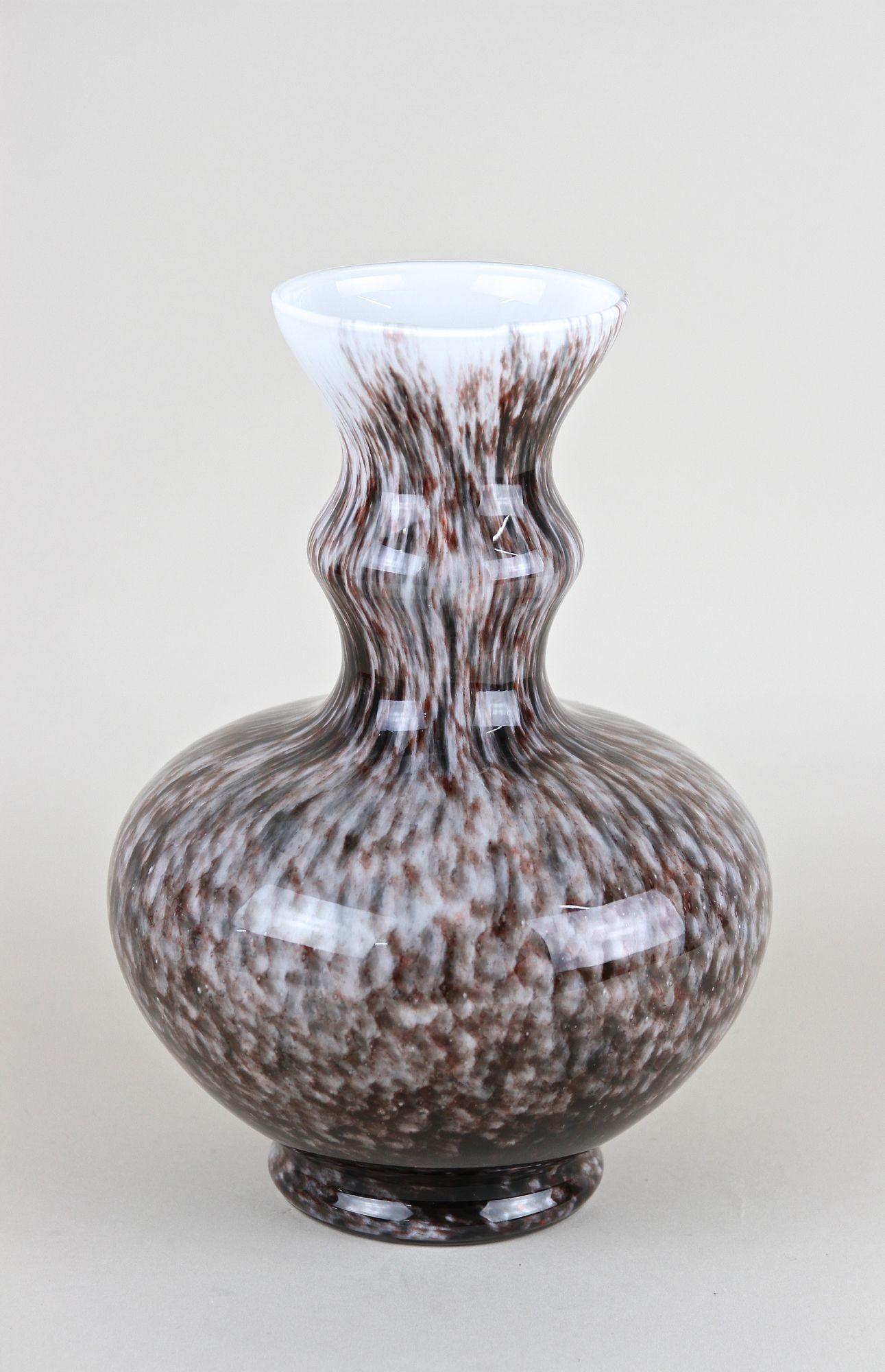 Contemporary 20th century glass vase coming from the famous workshops of the little island called Murano in Venice/ Italy. Artfully crafted in the early 1970s, this incredible piece of Italian glass art impresses with a beautiful shaped bulbous body