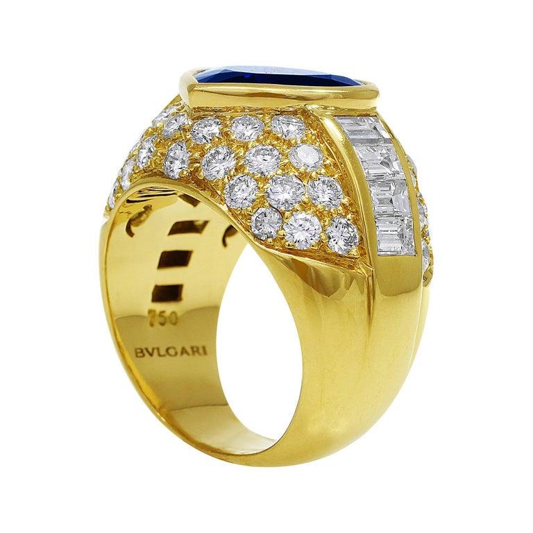 This beautiful estate signed Bulgari 18k yellow gold ring comes with a center 10.55ct Gubelin Lab certified sapphire. The ring has 8 side baguette diamonds and 52 round brilliant cut diamonds.

All information provided for your trust and comfort.