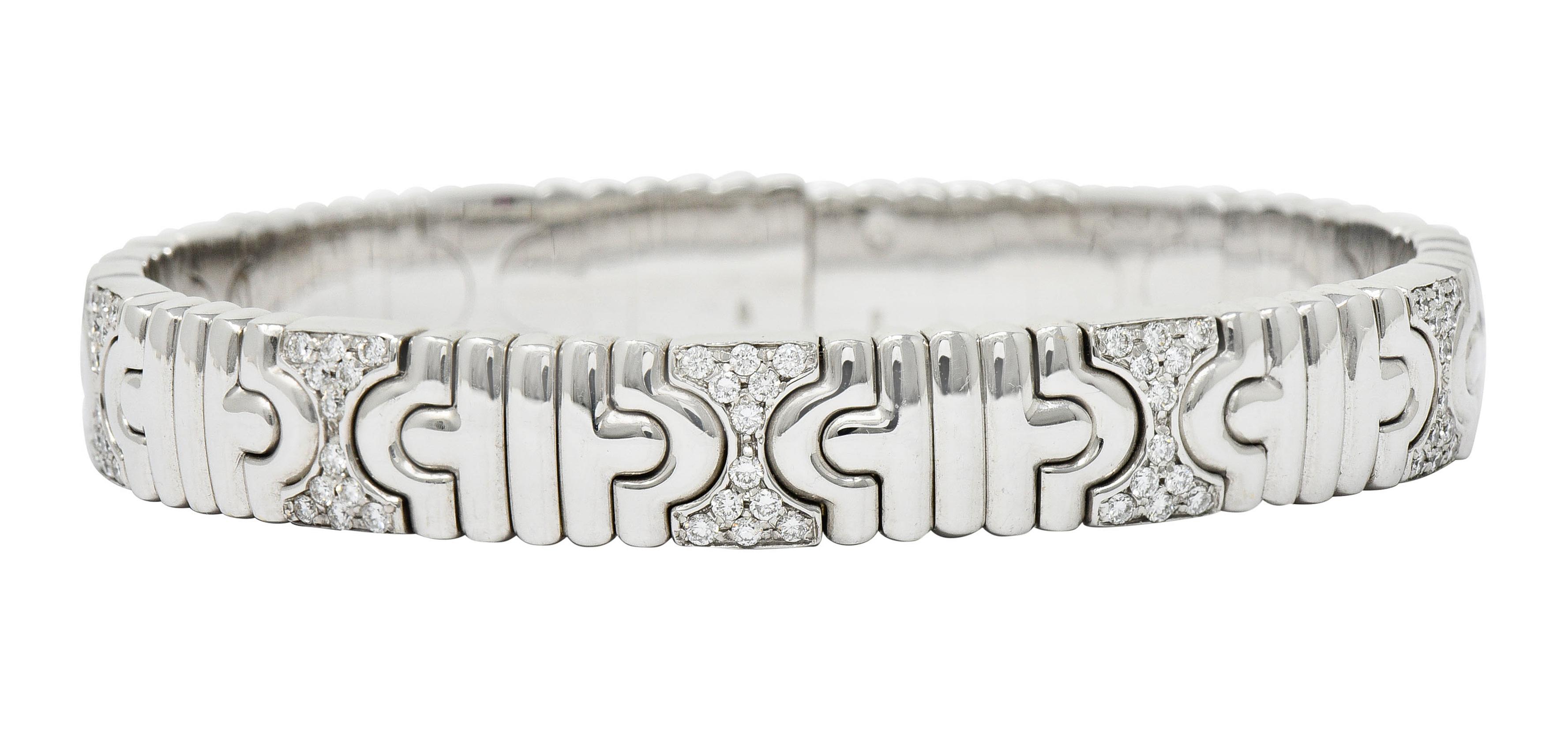 Cuff bracelet is comprised of curved chevron links alternating with an hour glass motif

Pavè set with round brilliant cut diamonds weighing in total approximately 1.50 carats - G/H color with VS clarity

With Italian assay marks for 18 karat gold