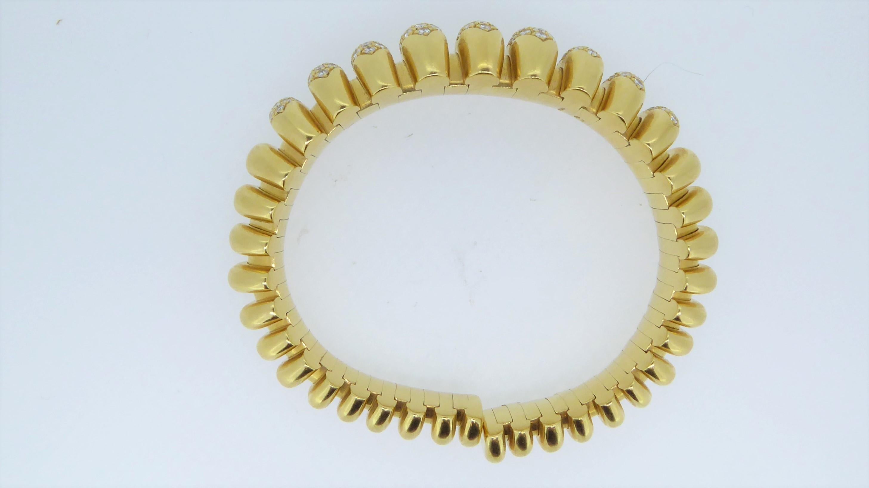 A Bulgari 18 Carat Yellow Gold And Diamond Celtaura bracelet bangle. Estimated 3.80cts of white diamonds. Numbered and signed 