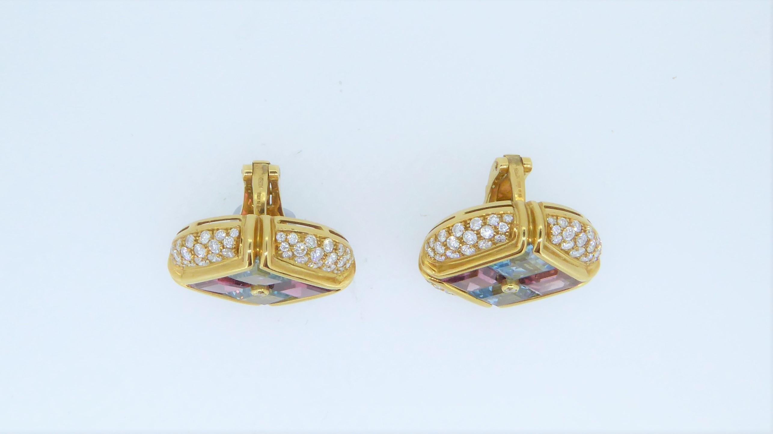 A Pair Of Bulgari 18 Carat Yellow Gold Multi-Gem And Diamond Carré Earrings. 
The earrings adorned with topaz and tourmaline, within a pavé-set diamond border. Signed 'Bulgari' '750' and numbered. Weighs approximately 34.7 grams in total. Each