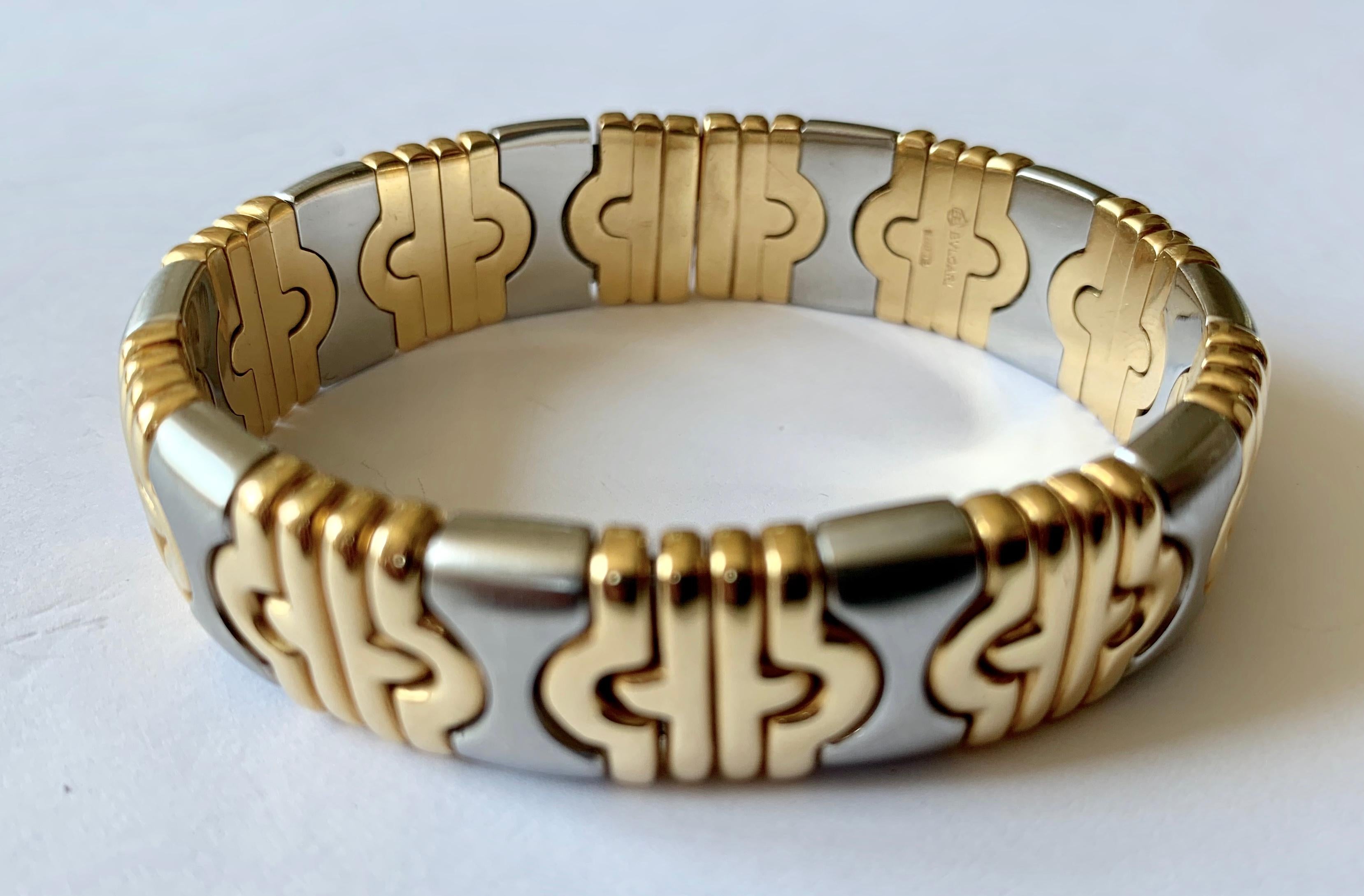 Bulgari Parentesi cuff bracelt in 18 K yellow gold and stainless steel. Diameter inside:55mm. 68.53 grams.